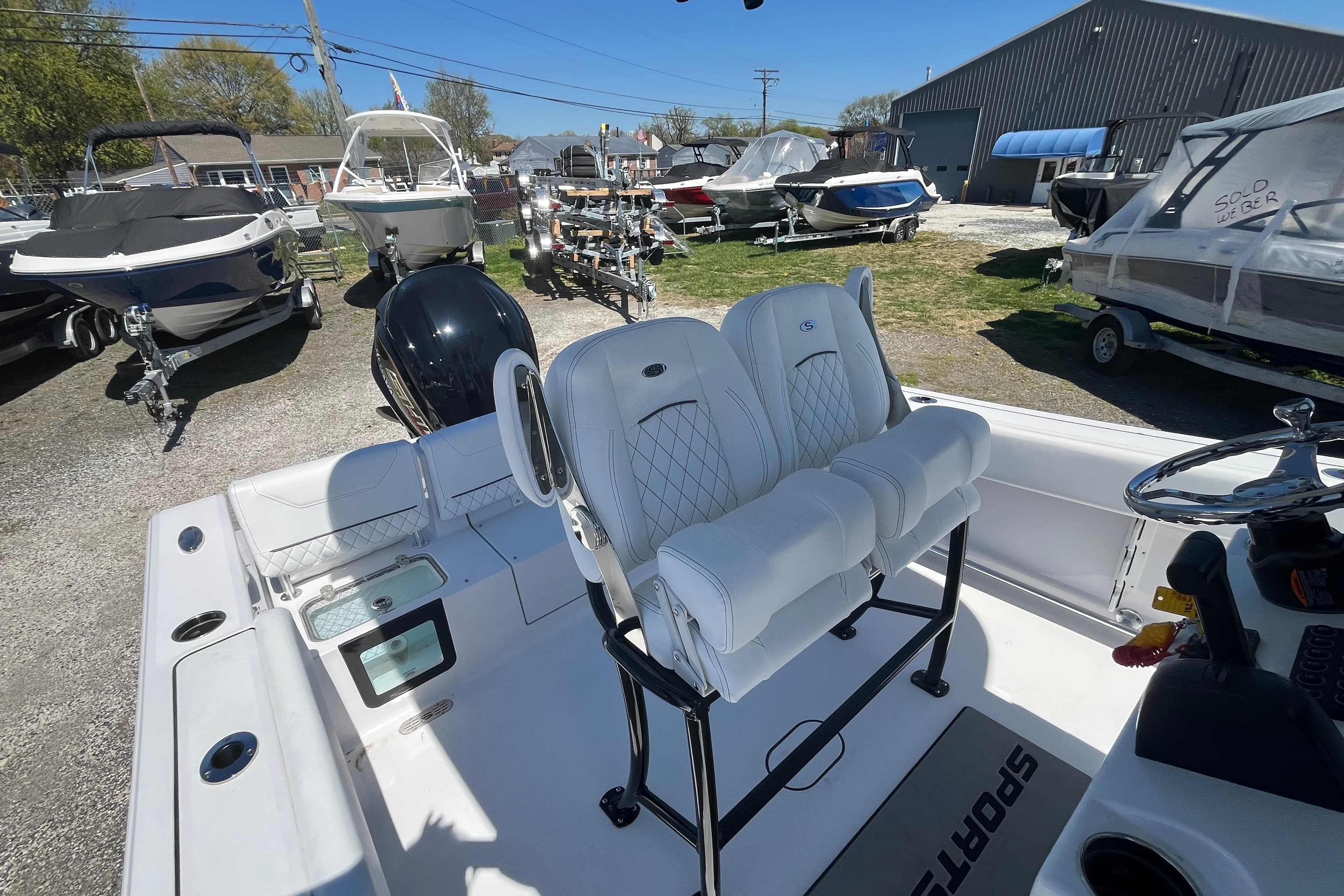 2026 Sportsman Heritage 231 Center Console boat with dual seats and modern design.