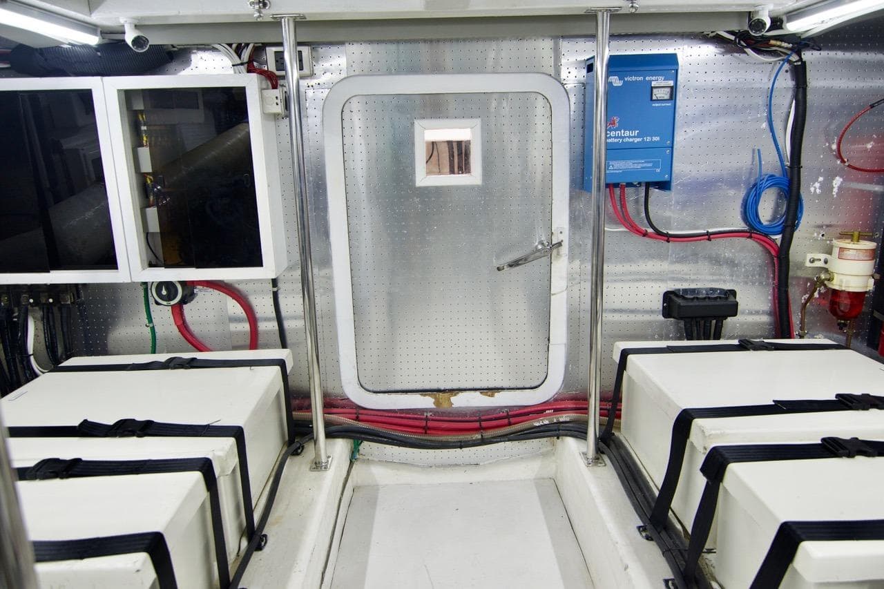 Engine room of 2007 Norseman 560 Sedan with equipment and wiring.