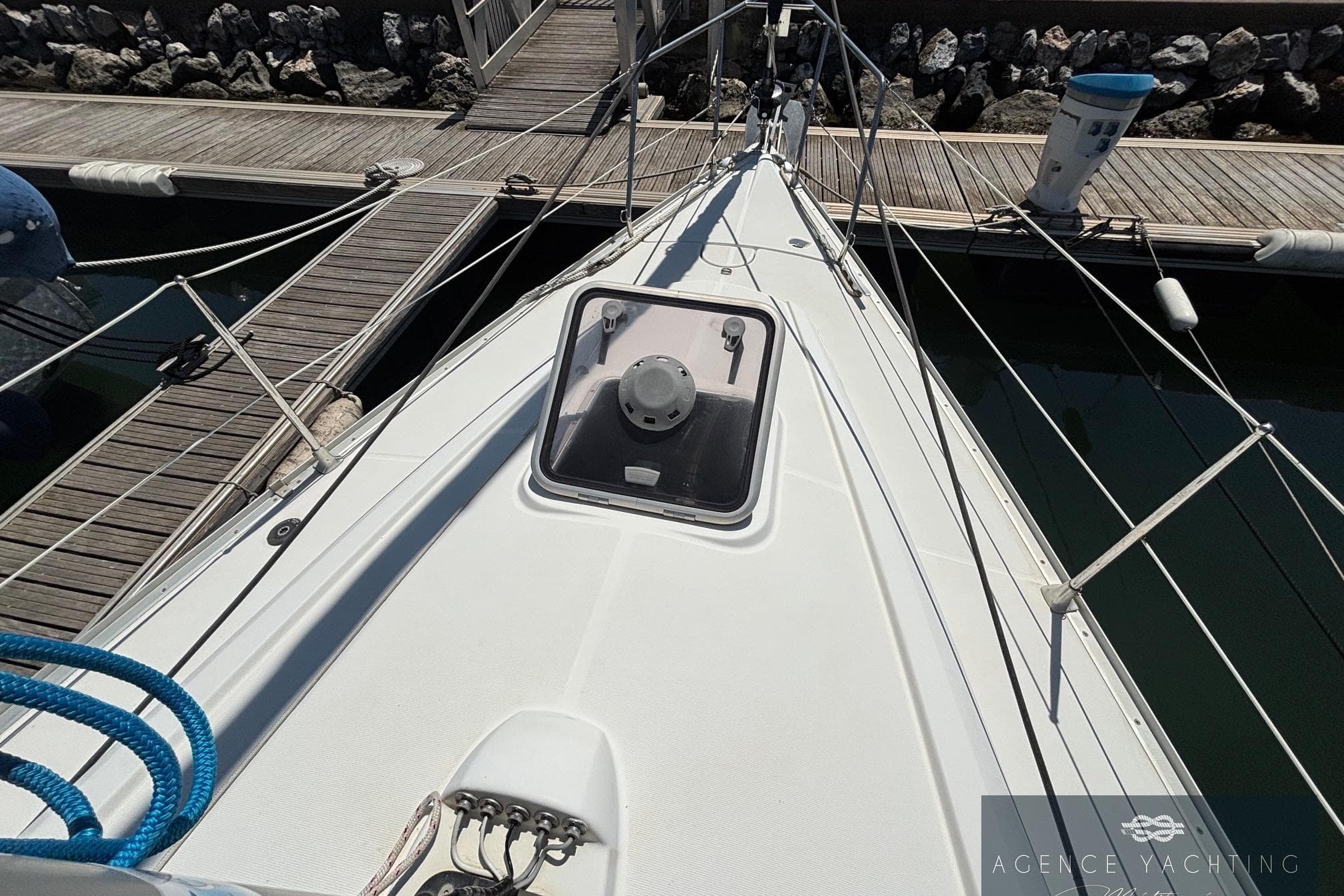 Deck view of a 2008 Jeanneau Sun Odyssey 32i yacht docked at a marina.