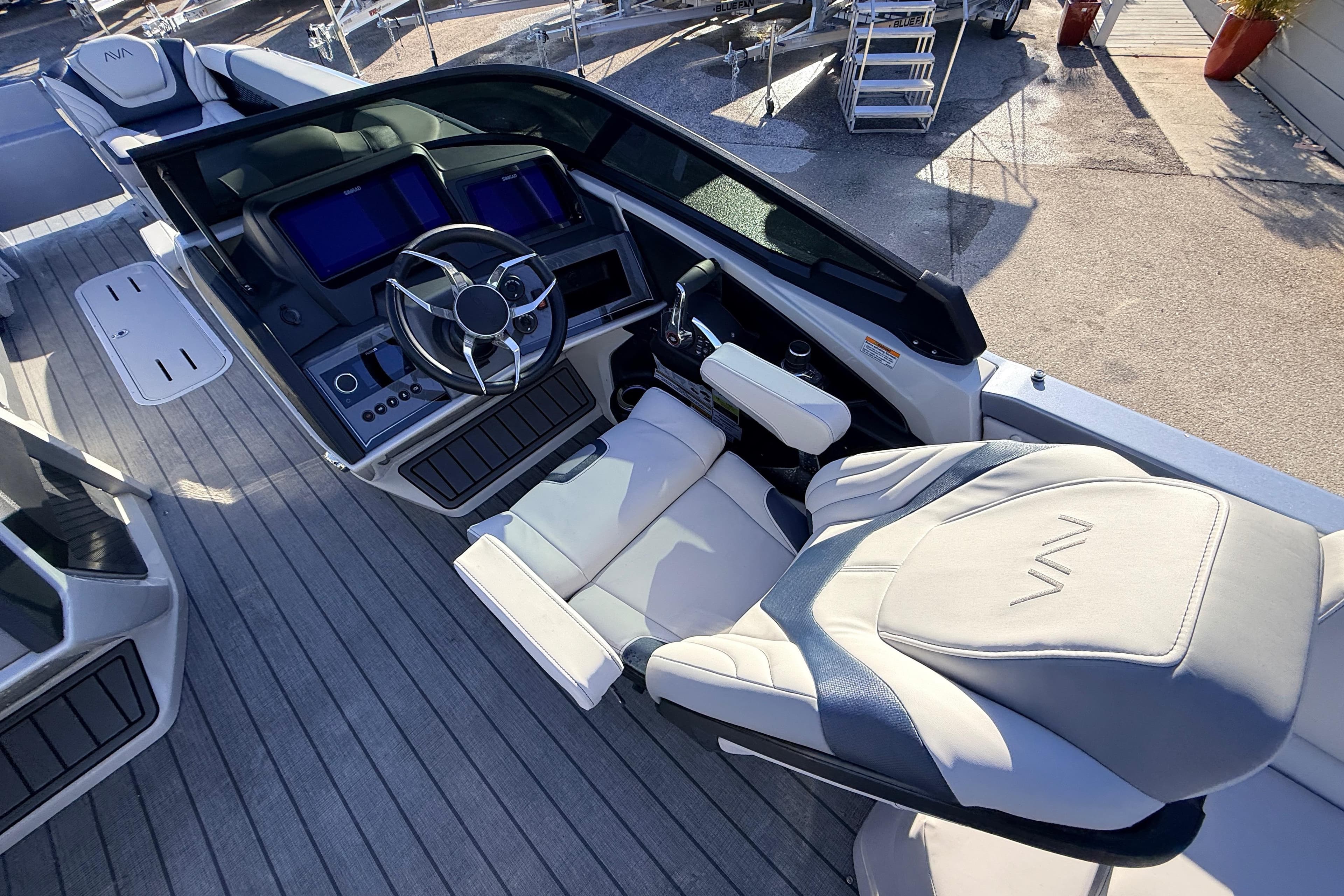 2026 Avalon Excalibur boat cockpit with modern controls and luxurious seating.