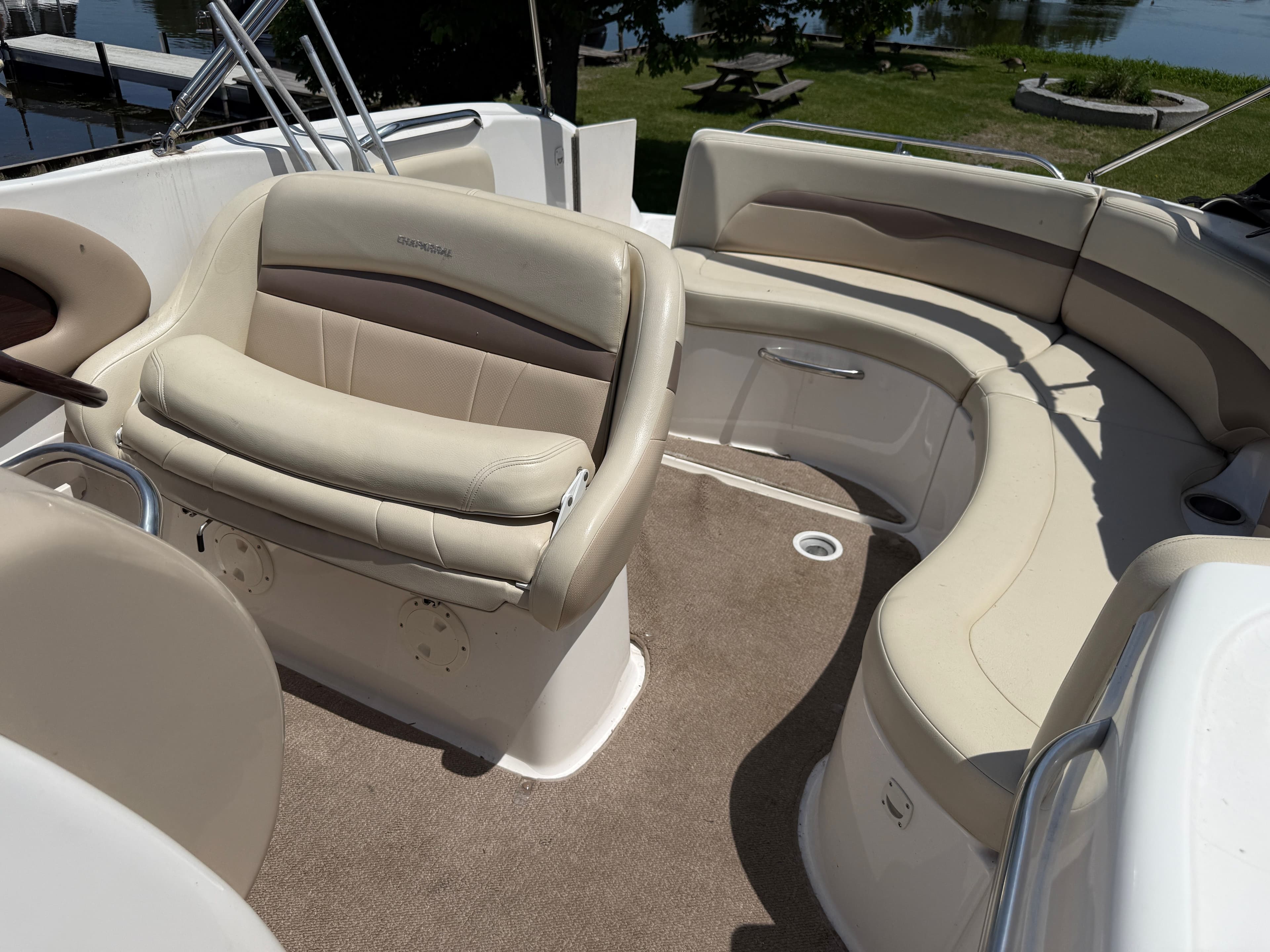 Interior of a 2005 Chaparral 252 Sunsesta boat with beige seating.