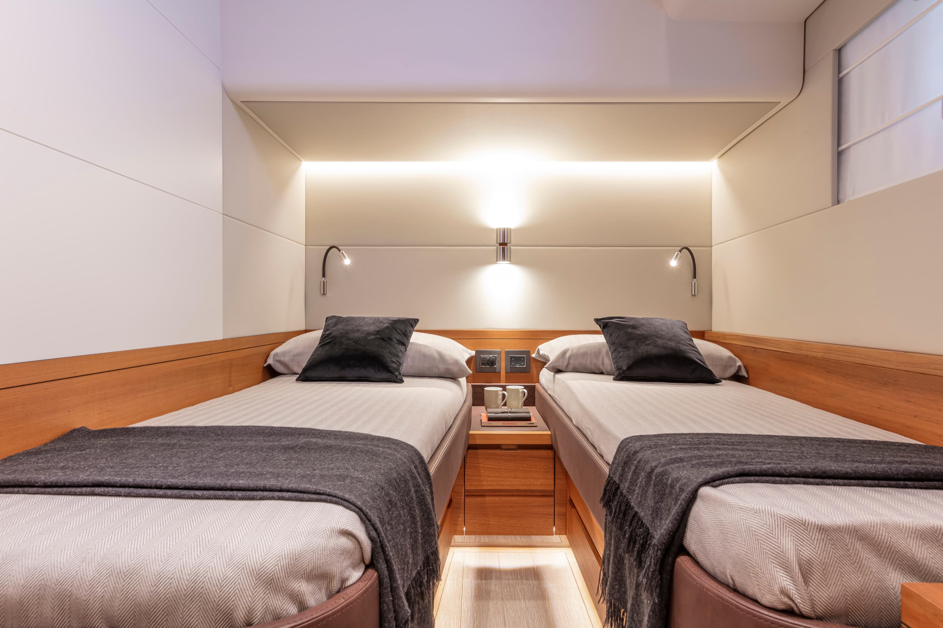 Luxurious twin cabin interior of 2026 Pardo Yachts E60, featuring modern design and cozy lighting.