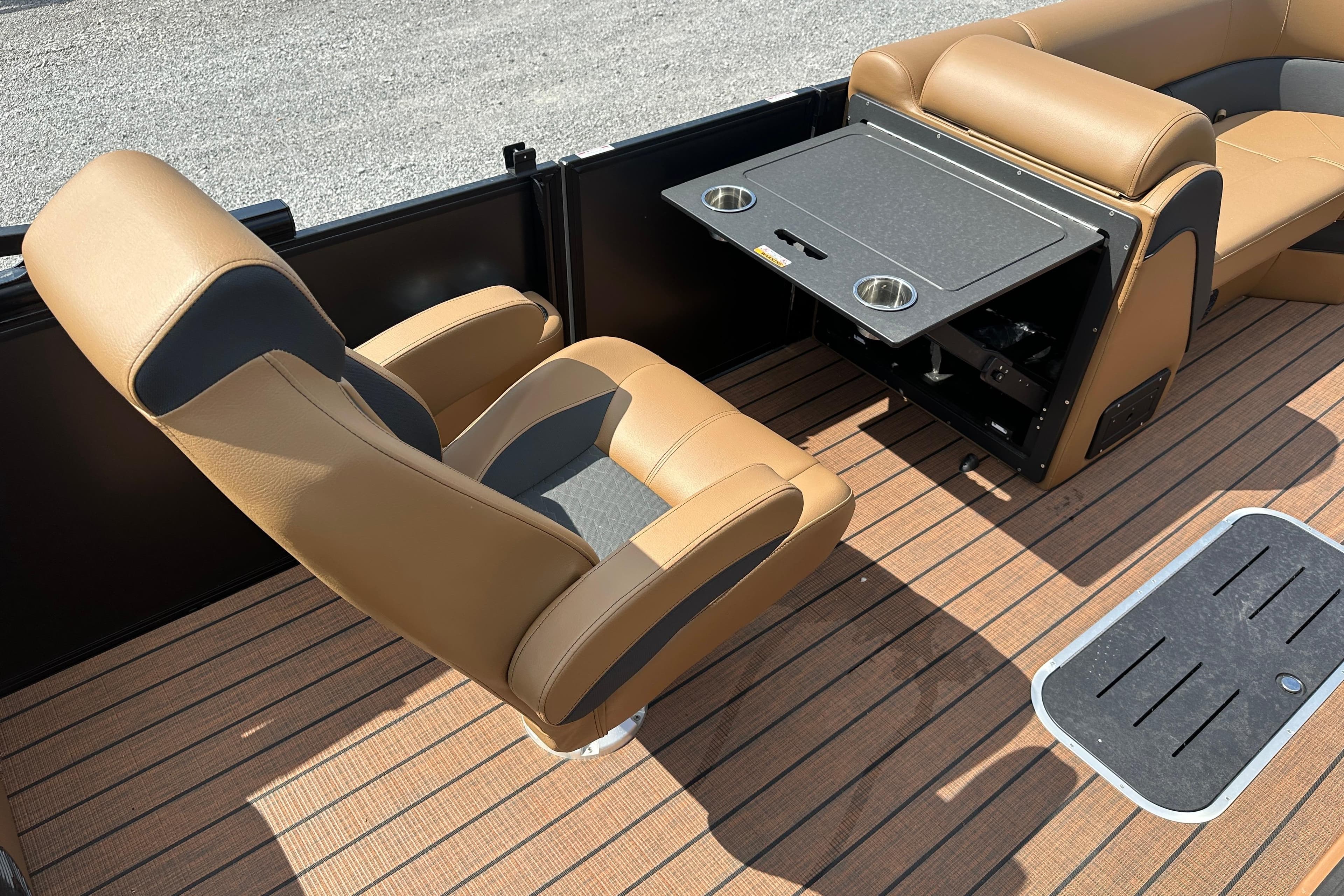 2025 Bentley Pontoons 223 Elite Swingback interior with tan seating and foldable table.
