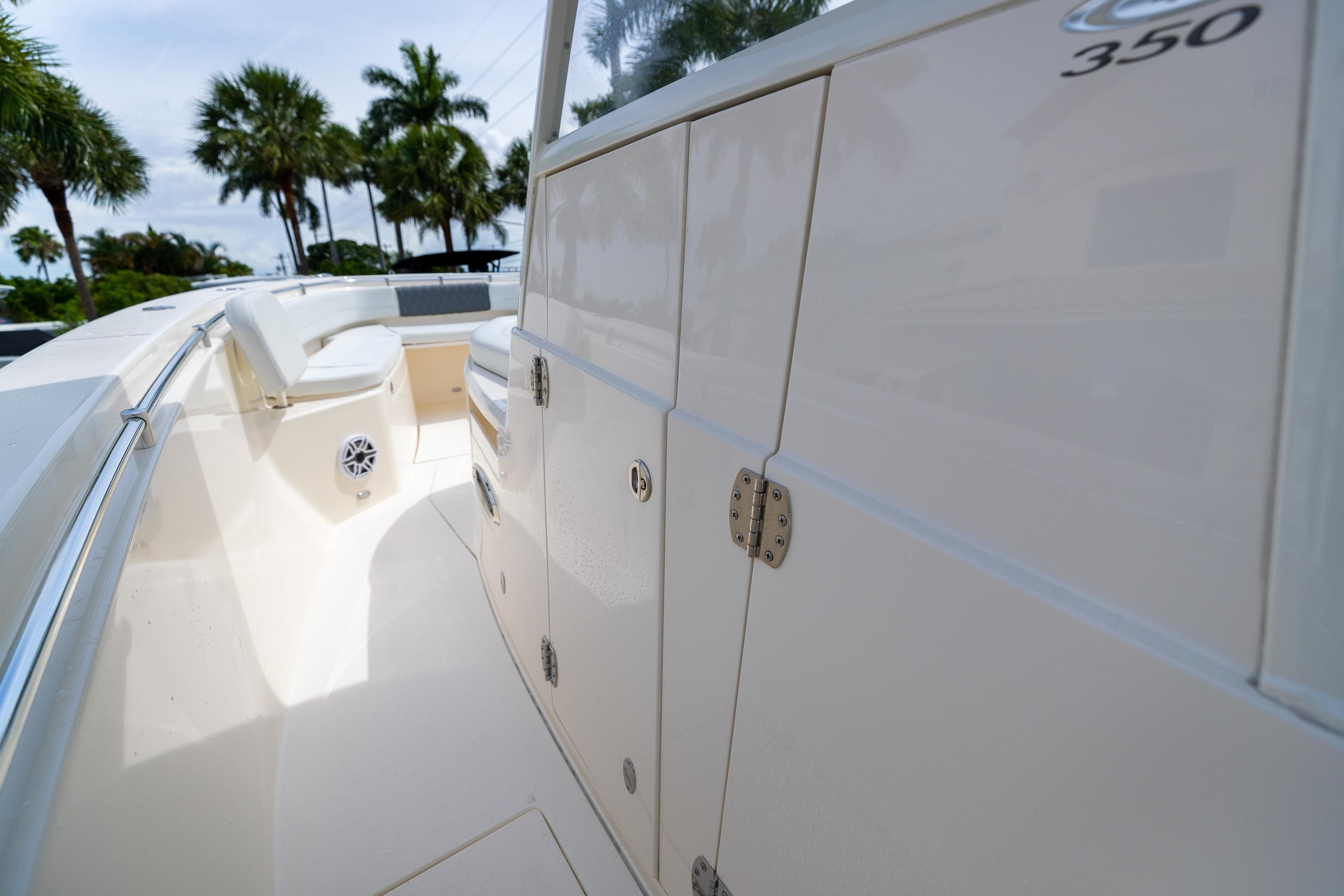 2023 Cobia 350 Center Console boat with sleek design and storage compartments.