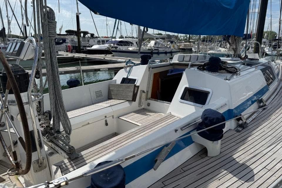 1988 Nautor Swan 36 sailboat docked, featuring a spacious cockpit and sleek design.