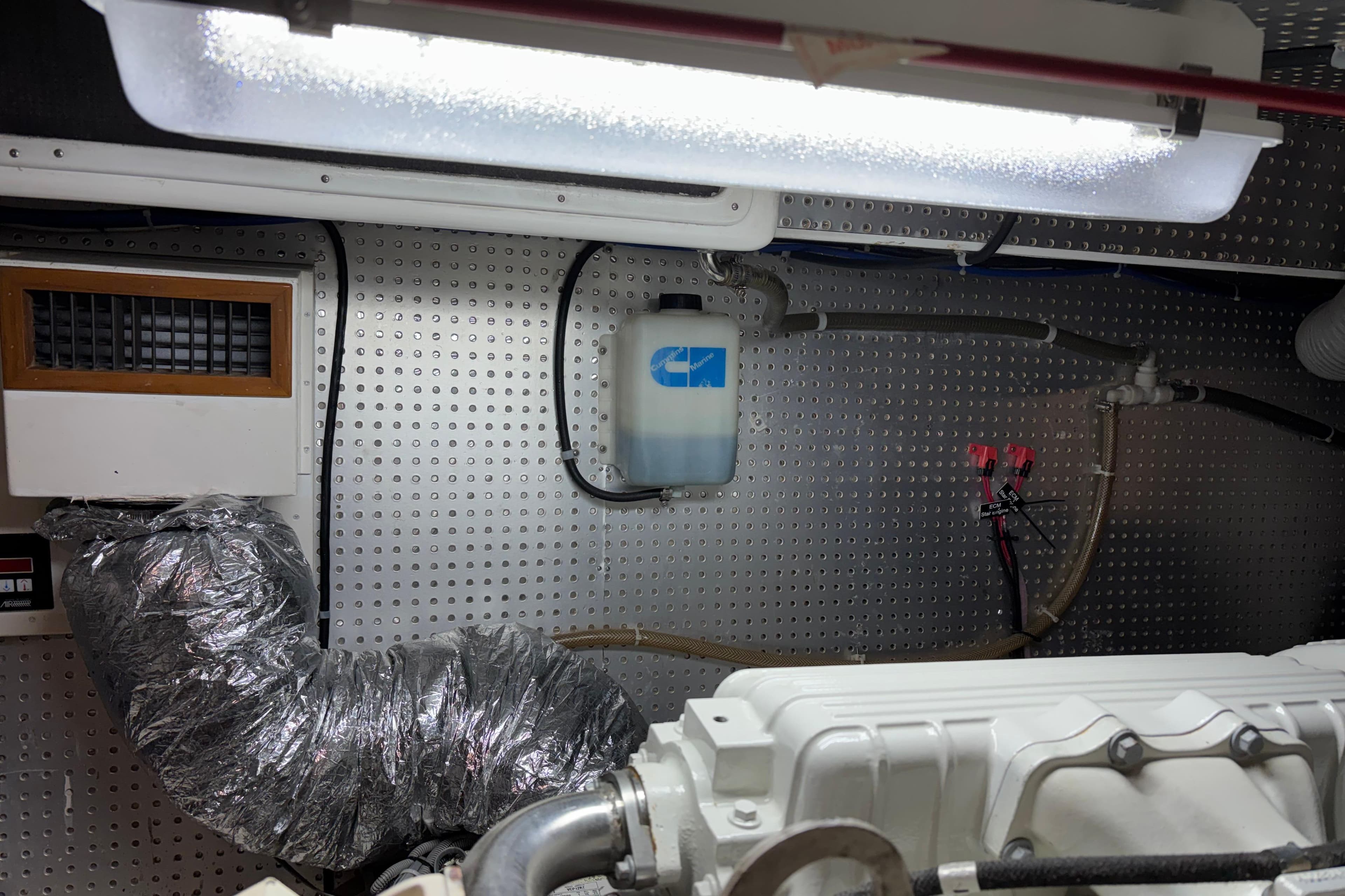 Engine room of a 2004 Hampton F/B Cruiser with ventilation and wiring.