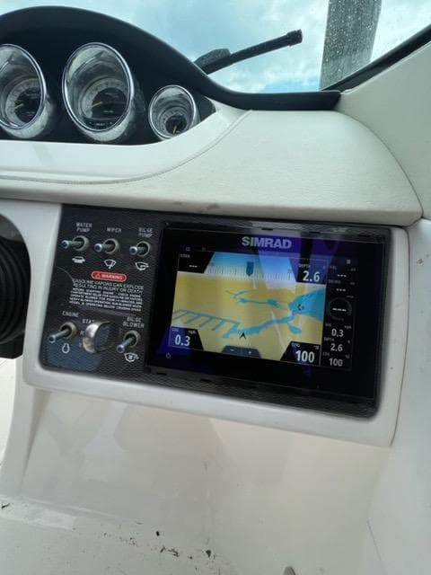 2013 Sea Ray 240 Sundeck dashboard with Simrad navigation system.