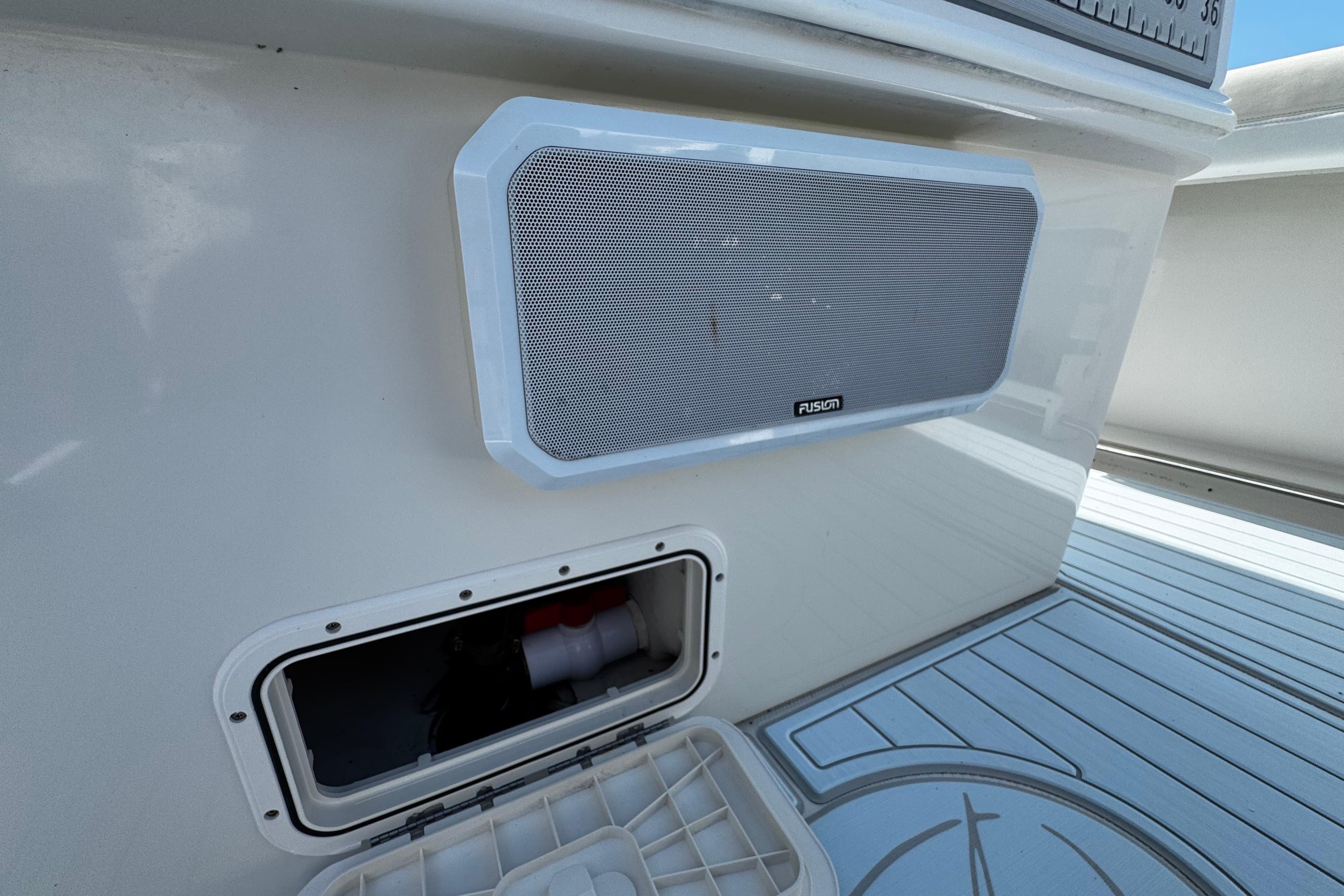 Speaker and storage compartment on 2015 Sailfish 320 CC boat deck.