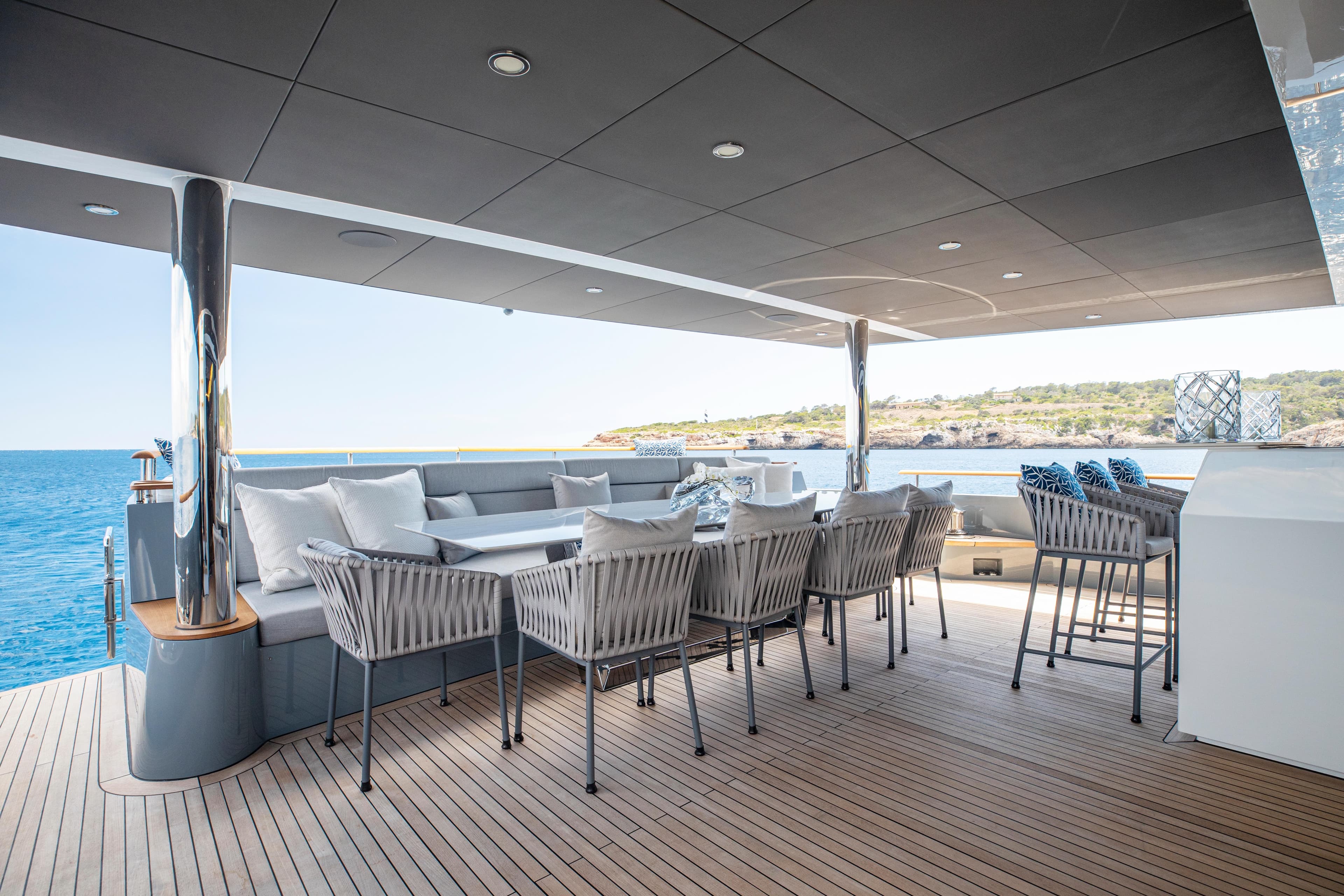 Luxury deck of 2023 Numarine 37XP yacht with elegant seating and ocean view.