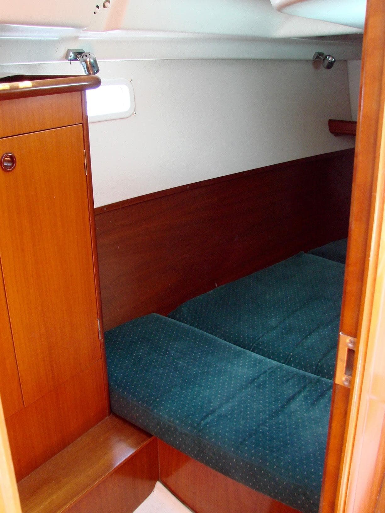 Interior of a 2001 Beneteau 331 yacht with wooden furnishings.