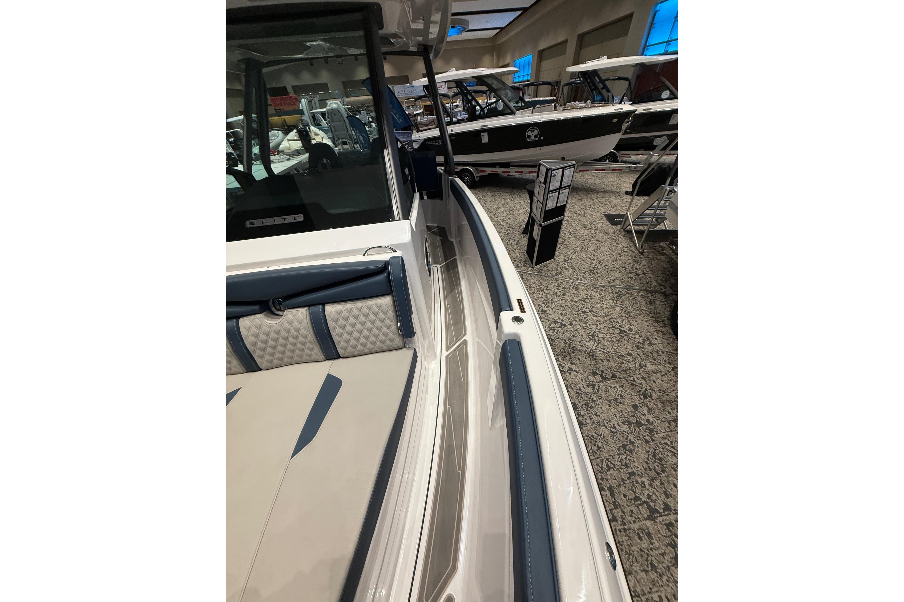 2026 Monterey Elite 25 OB boat interior at a showroom display.