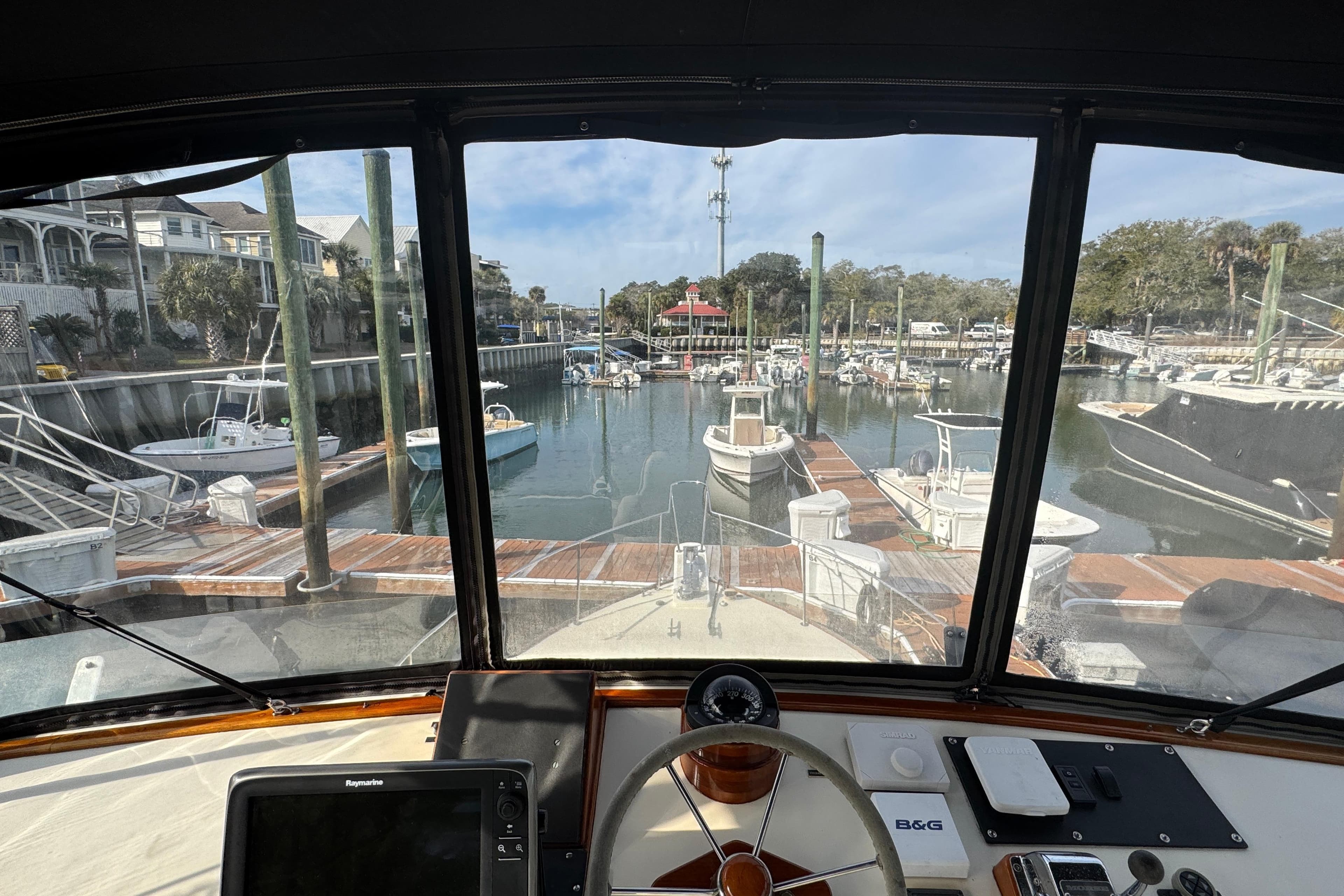 View from Ellis 36 Flybridge 2001, overlooking marina with boats and docks.