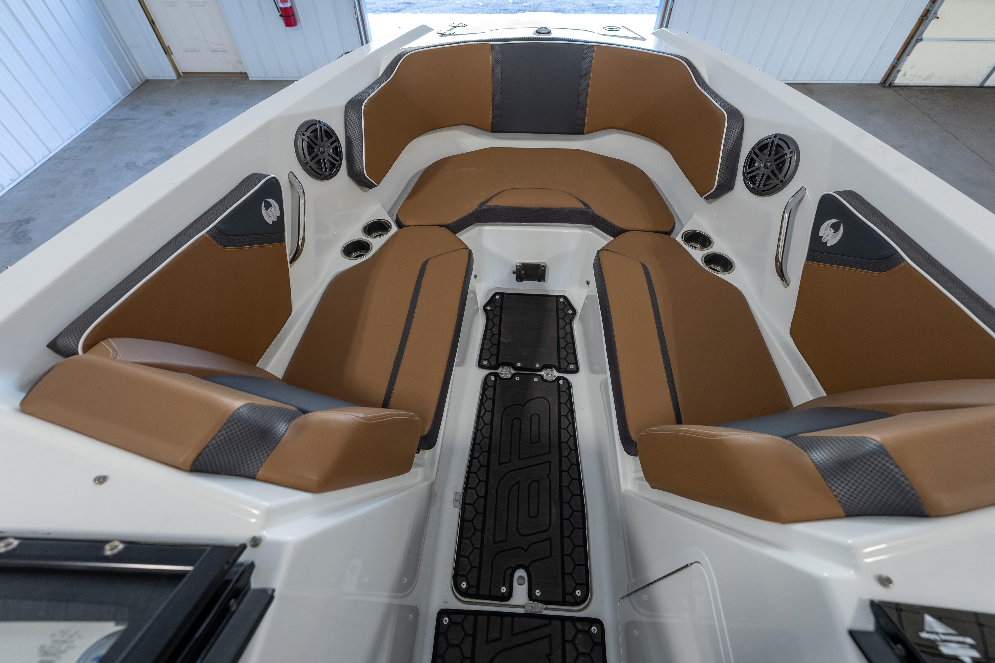 2023 Scarab 255 ID boat interior with brown seating and modern design.