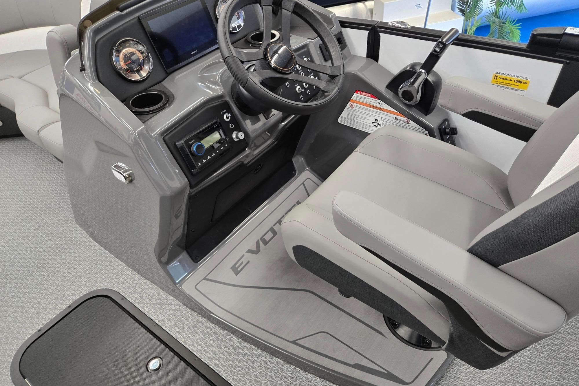 Cockpit of 2026 Evotti 521CS boat with modern controls and comfortable seating.