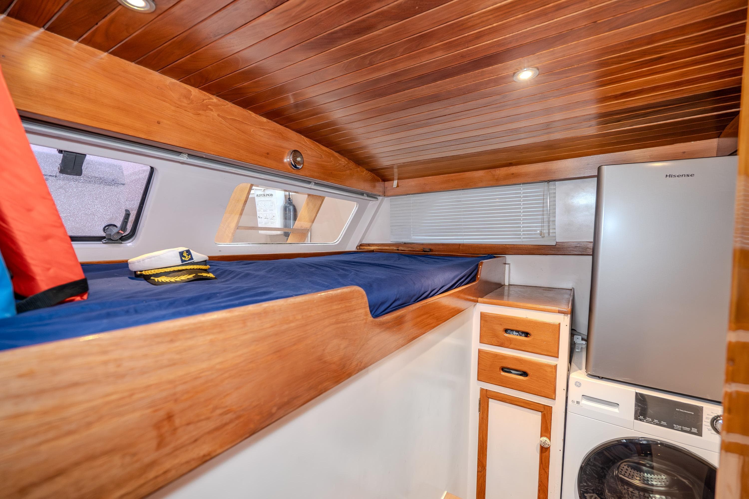 1973 American Marine Alaskan 53 cabin with wooden interior, bunk bed, and appliances.