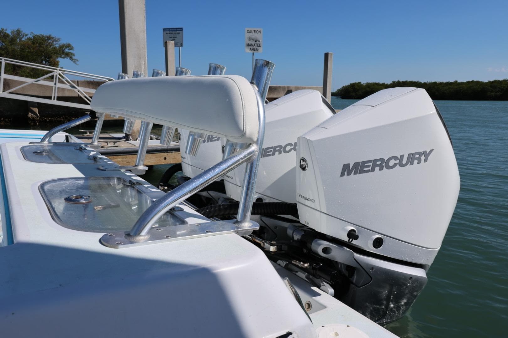 2003 Contender 36 Open boat with dual Mercury outboard engines at a dock.