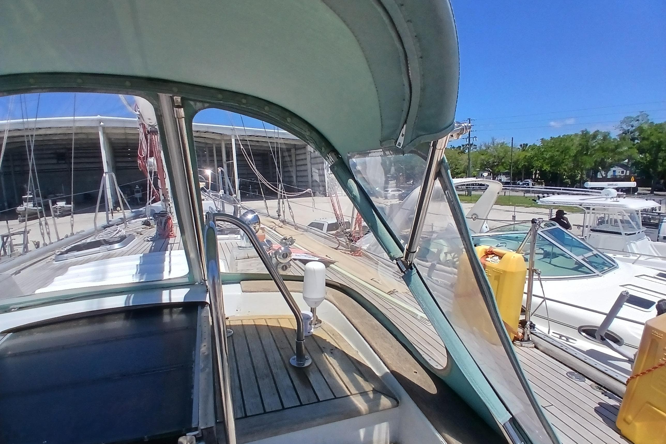 Cockpit view of 1981 Kaufman Skye 51 sailboat docked at marina.