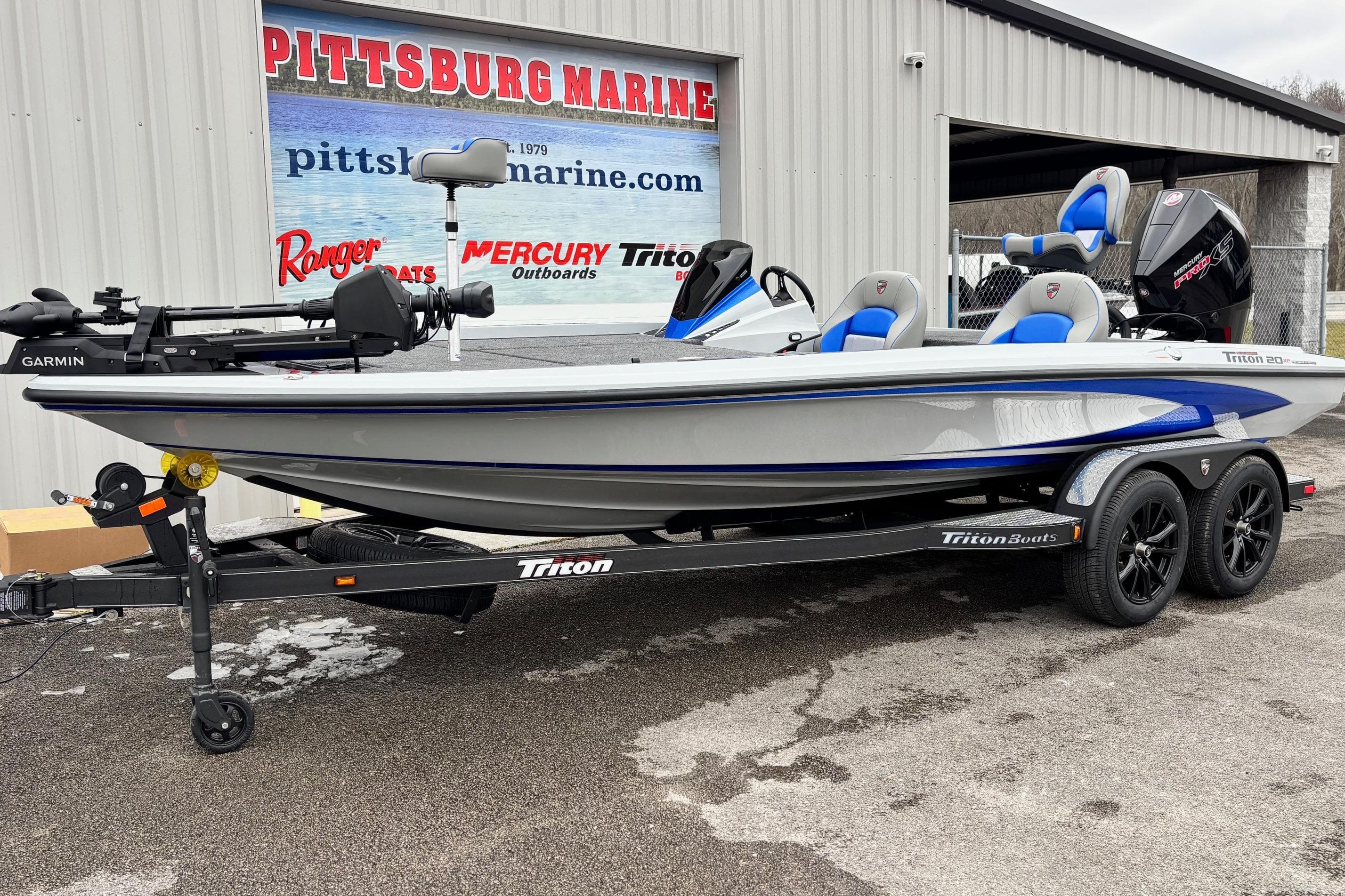 2026 Triton 20XP Patriot boat on trailer at Pittsburg Marine dealership.