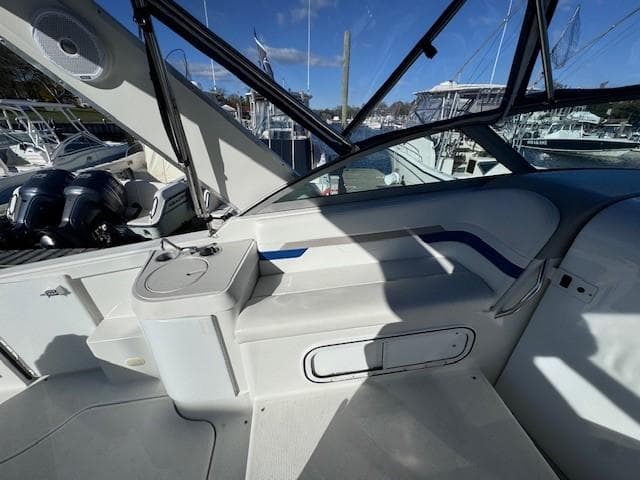 2003 Formula 27 PC boat interior with seating and storage, docked at marina.