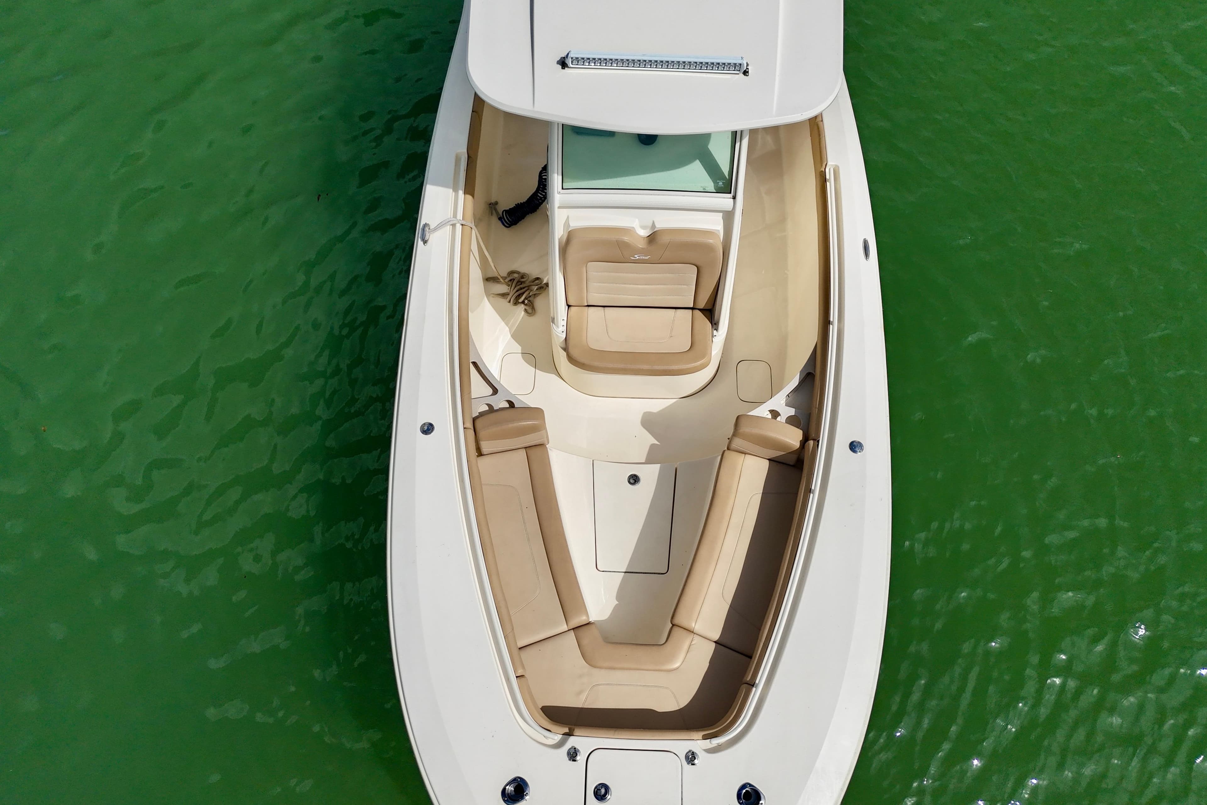 2019 Scout 275 LXF boat, aerial view, on green water.