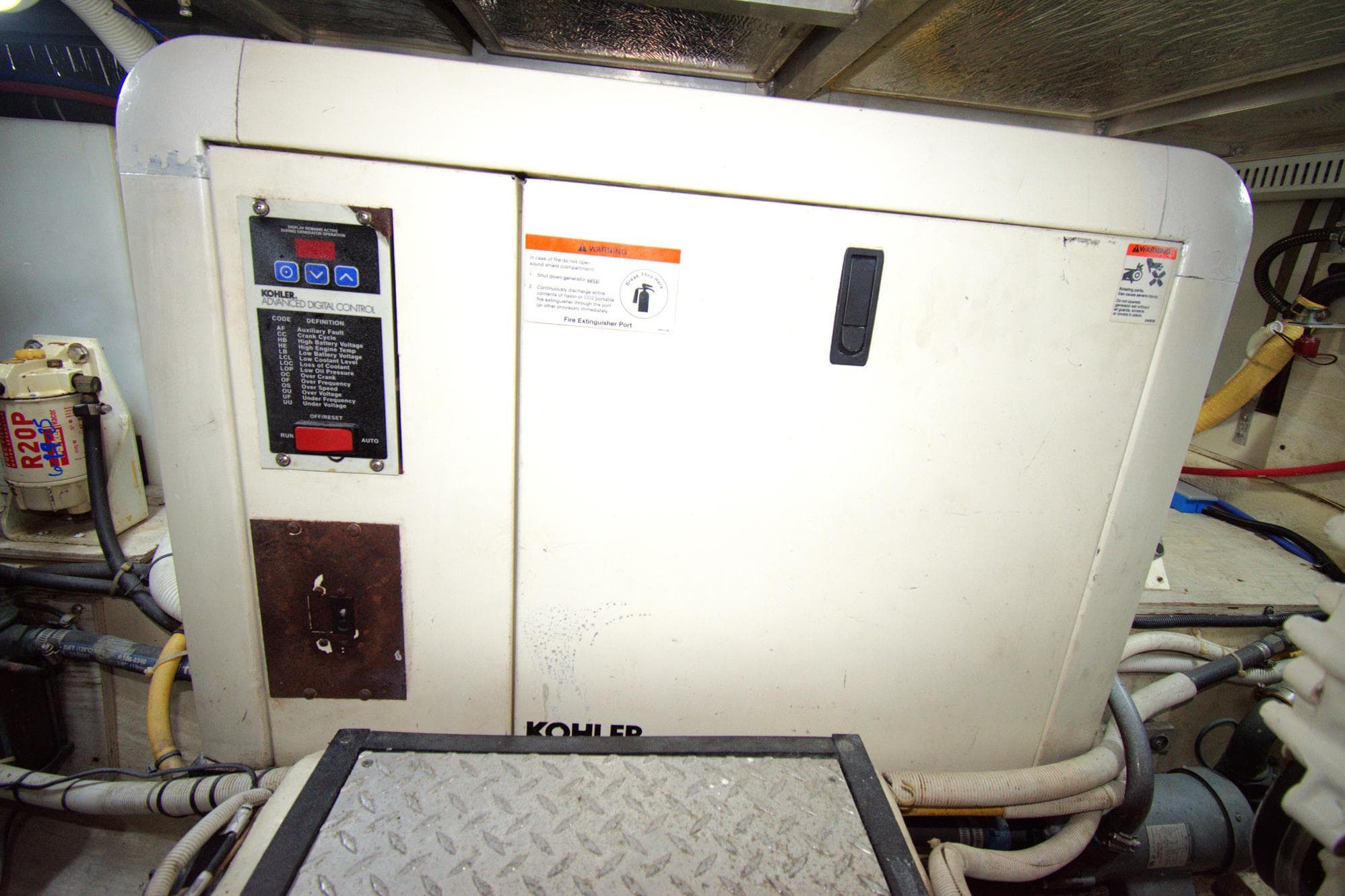 Engine room of 2005 Carver 444 Cockpit Motor Yacht with Kohler generator.