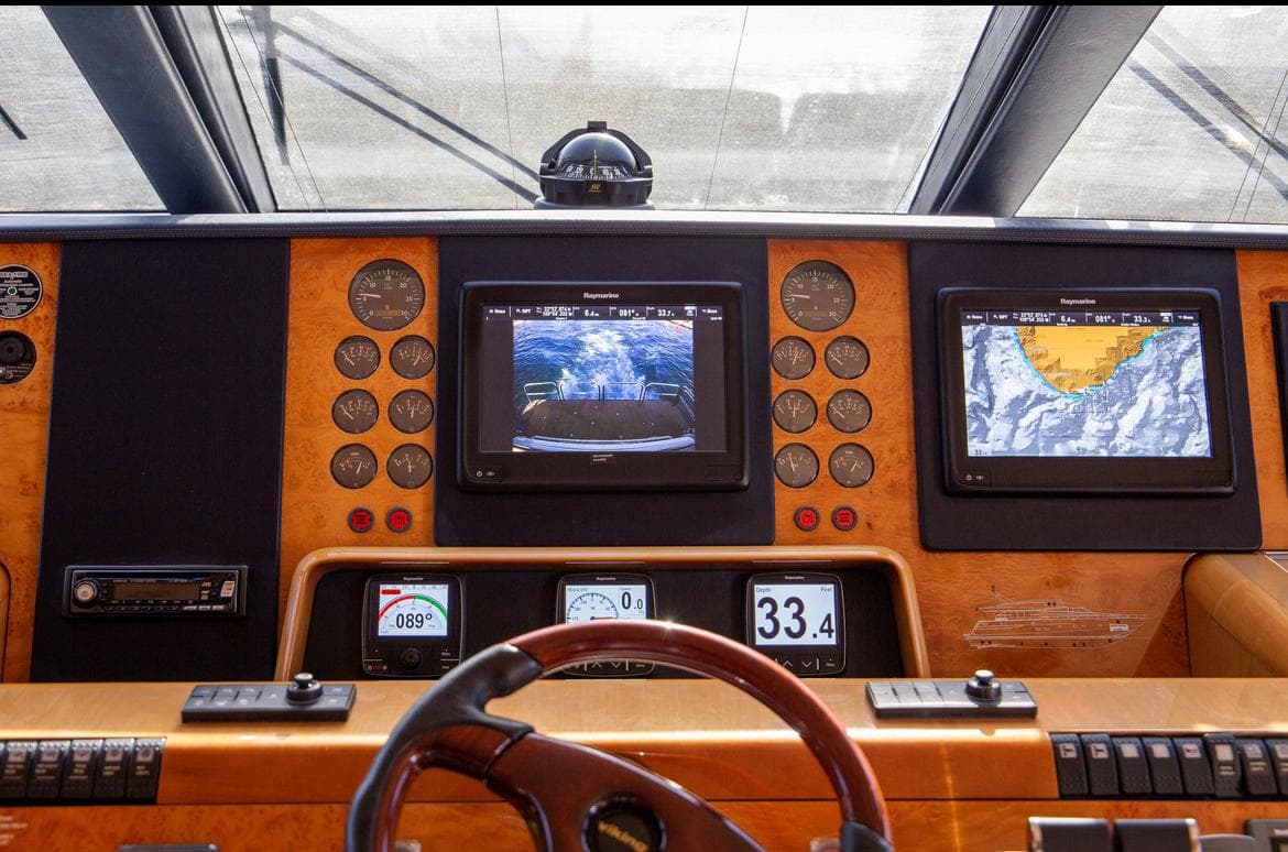 Cockpit of 2002 Viking Princess motor yacht with navigation screens and controls.