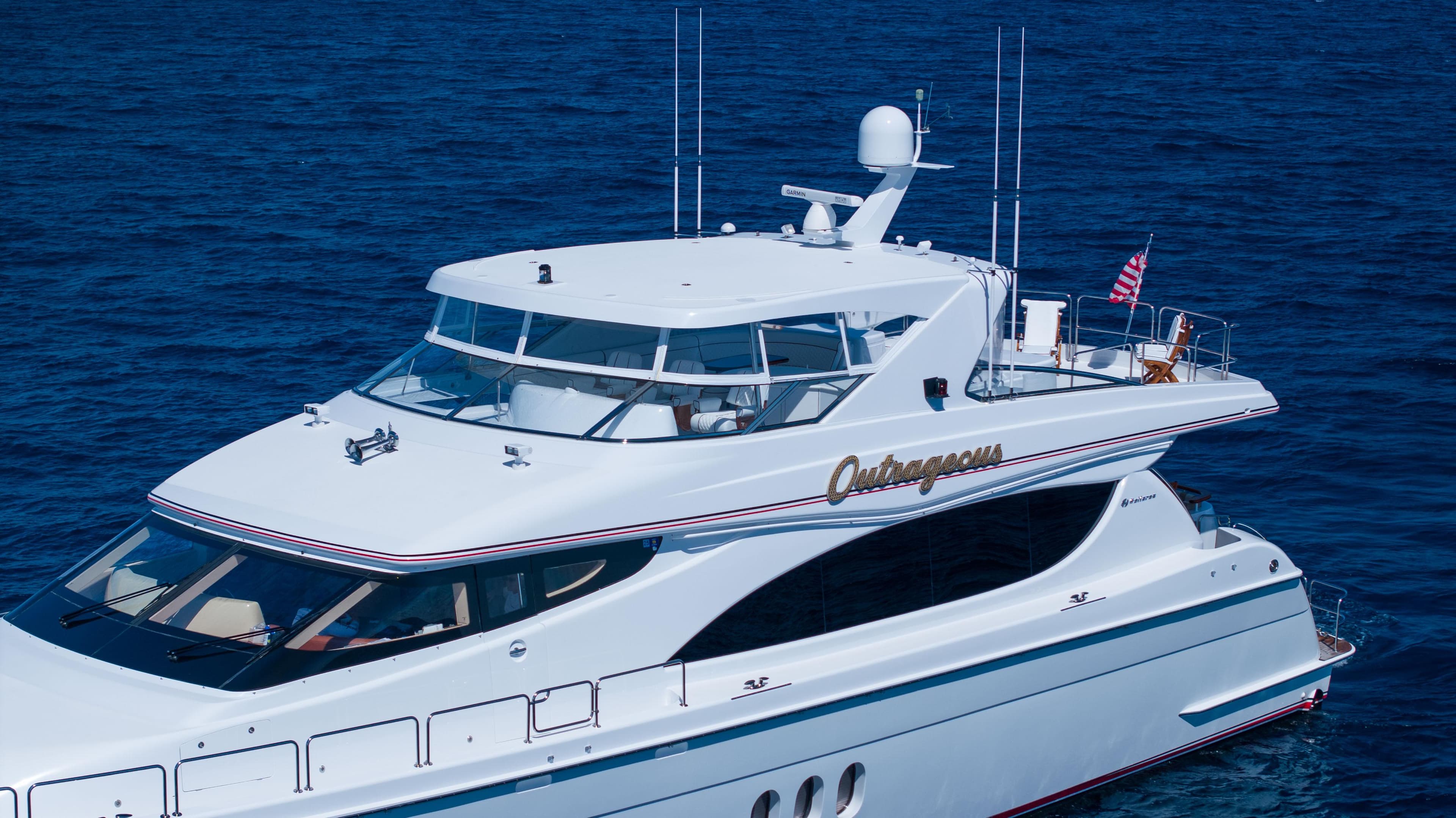 2005 Hatteras 80 Motor Yacht cruising on open sea, featuring sleek design and luxury amenities.