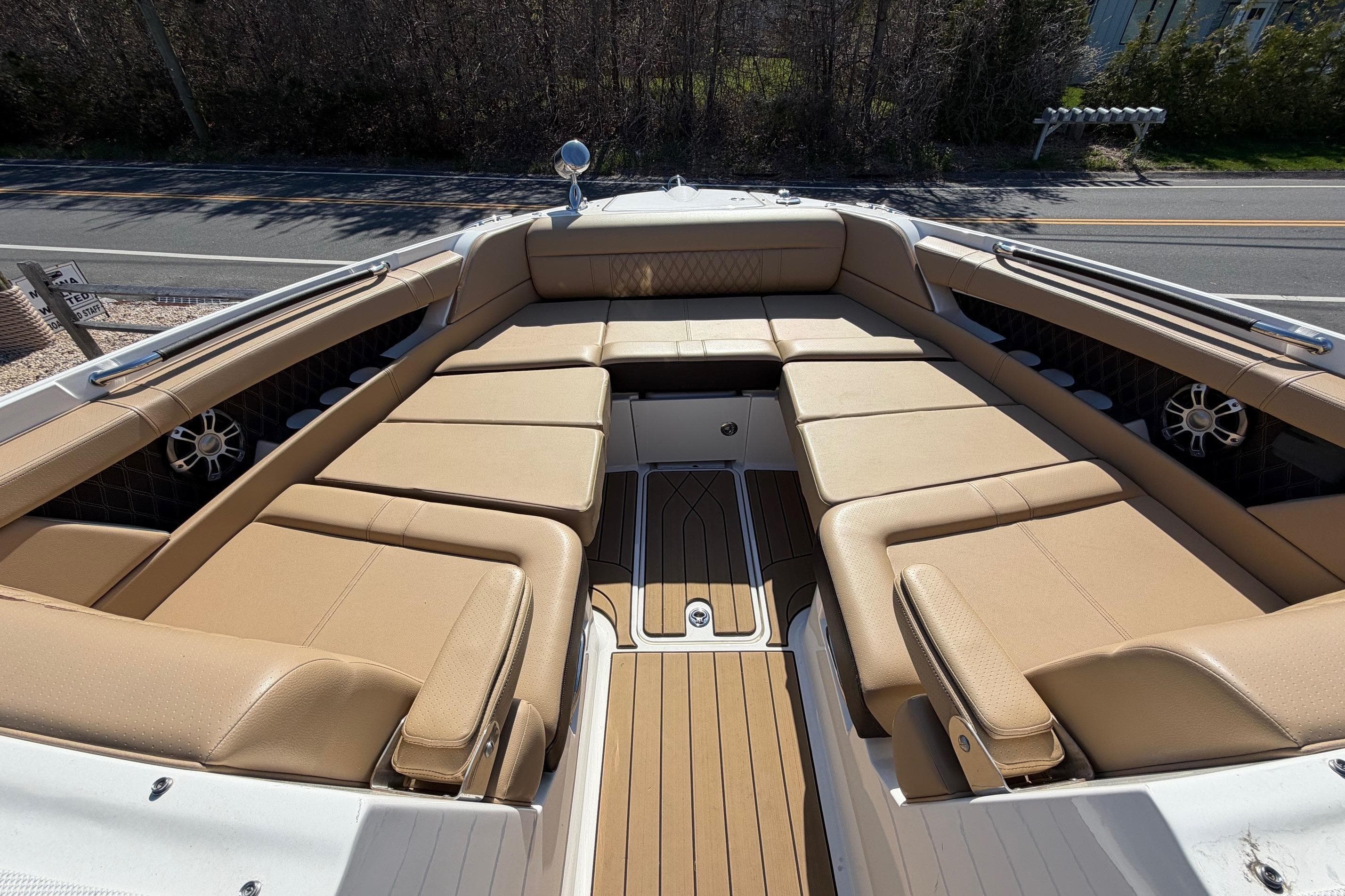 2023 Sea Ray SLX 350 Outboard boat with spacious tan seating and sleek design.