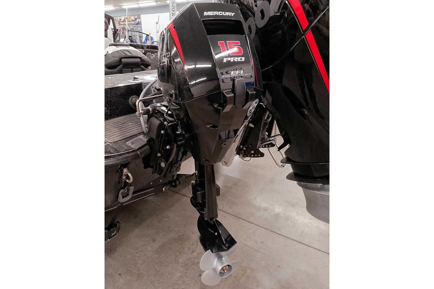 2026 Ranger 620xFS Pro with Mercury 15 Pro outboard motor in a garage setting.