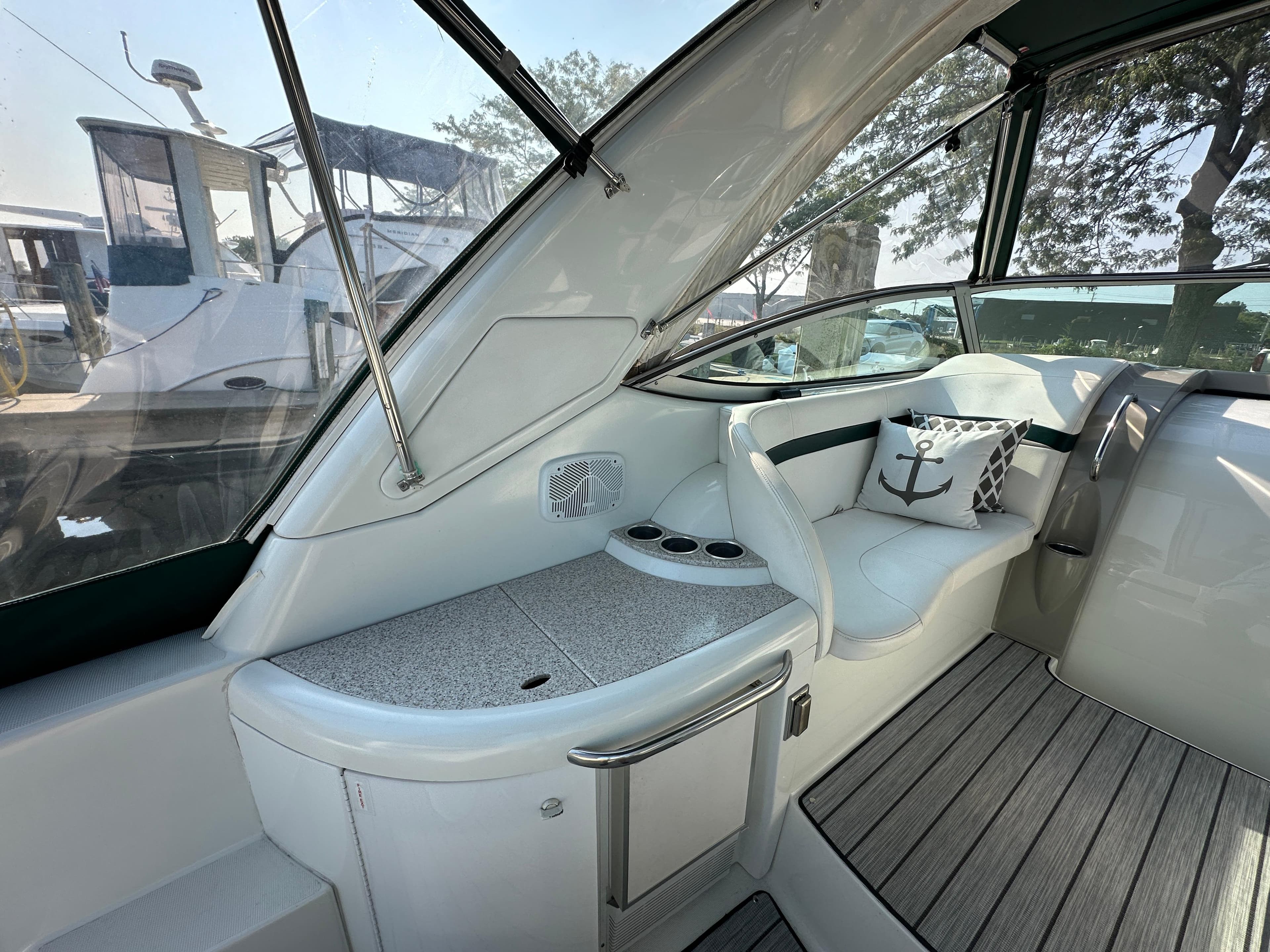 2004 Formula 34 PC yacht interior with cushioned seating and nautical-themed decor.