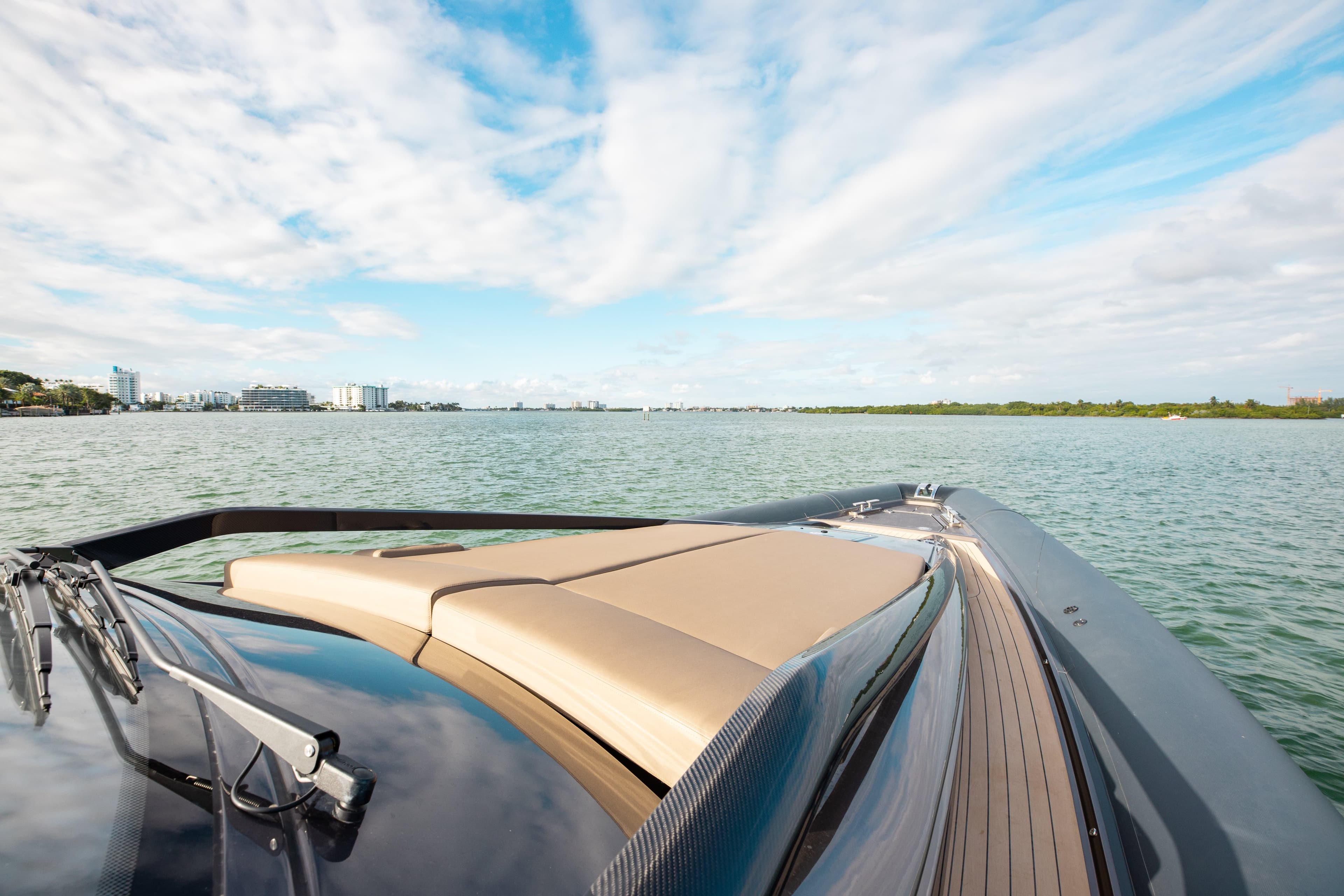 Luxury Anvera 48 yacht cruising on serene waters under a blue sky, 2025 model.