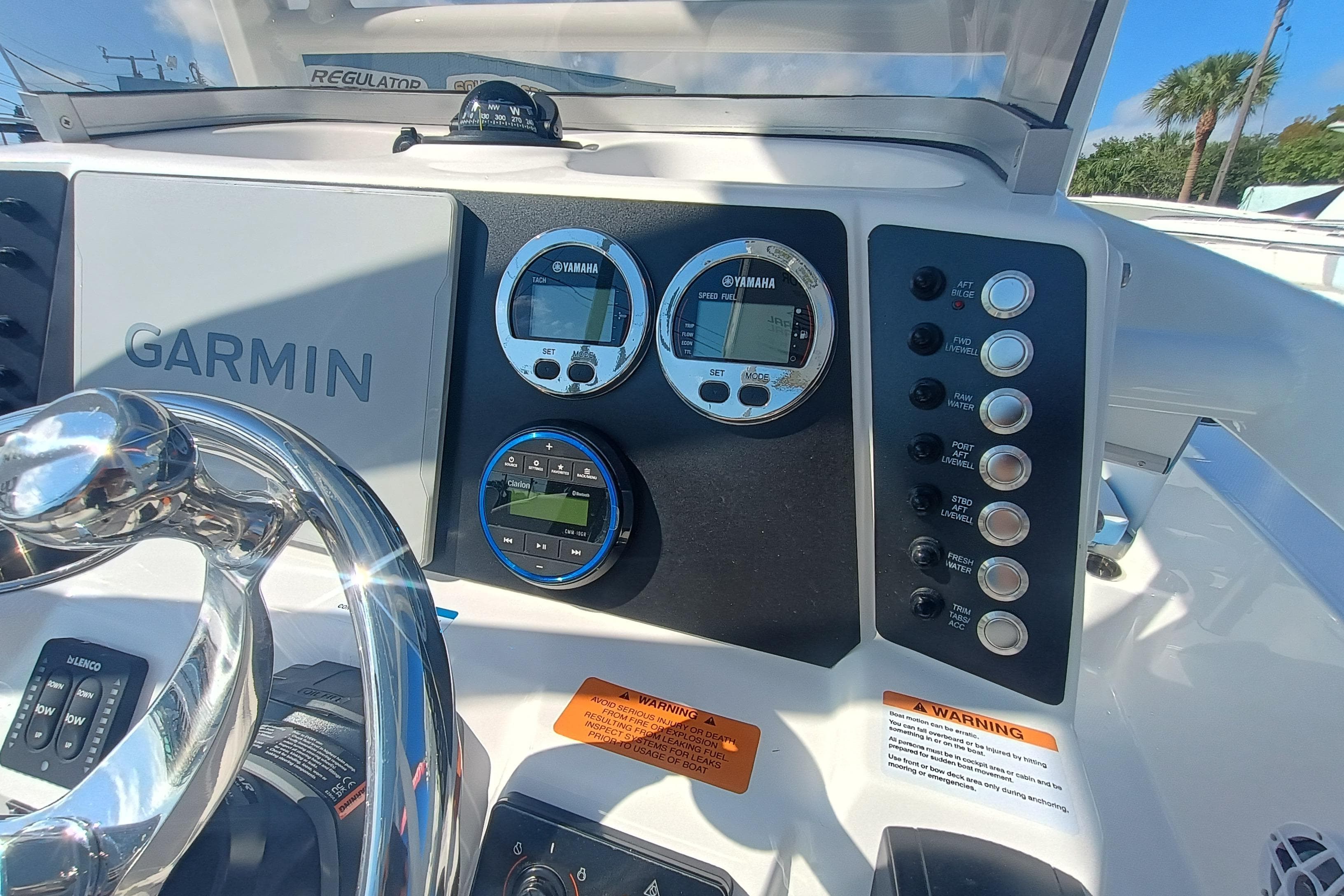 2026 Robalo 226 Cayman boat dashboard with Garmin and Yamaha displays.