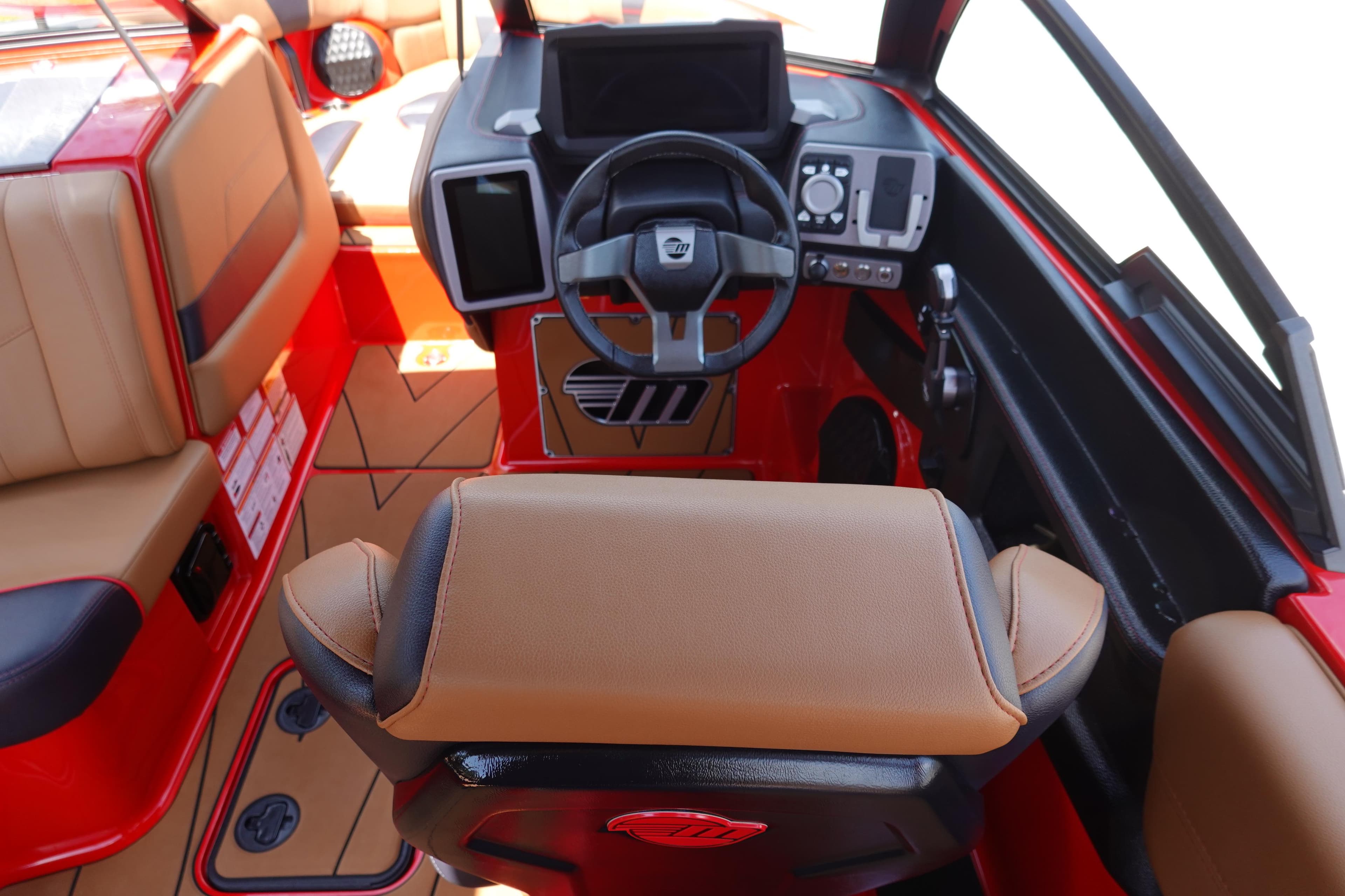 2023 Malibu 23 LSV boat interior with steering wheel and dashboard.