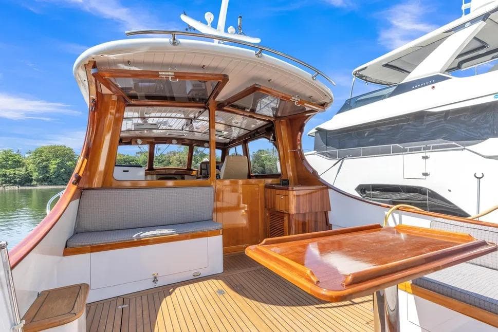 Luxurious 2007 Gorbon Custom Downeast 40 yacht with elegant wood interior and seating.