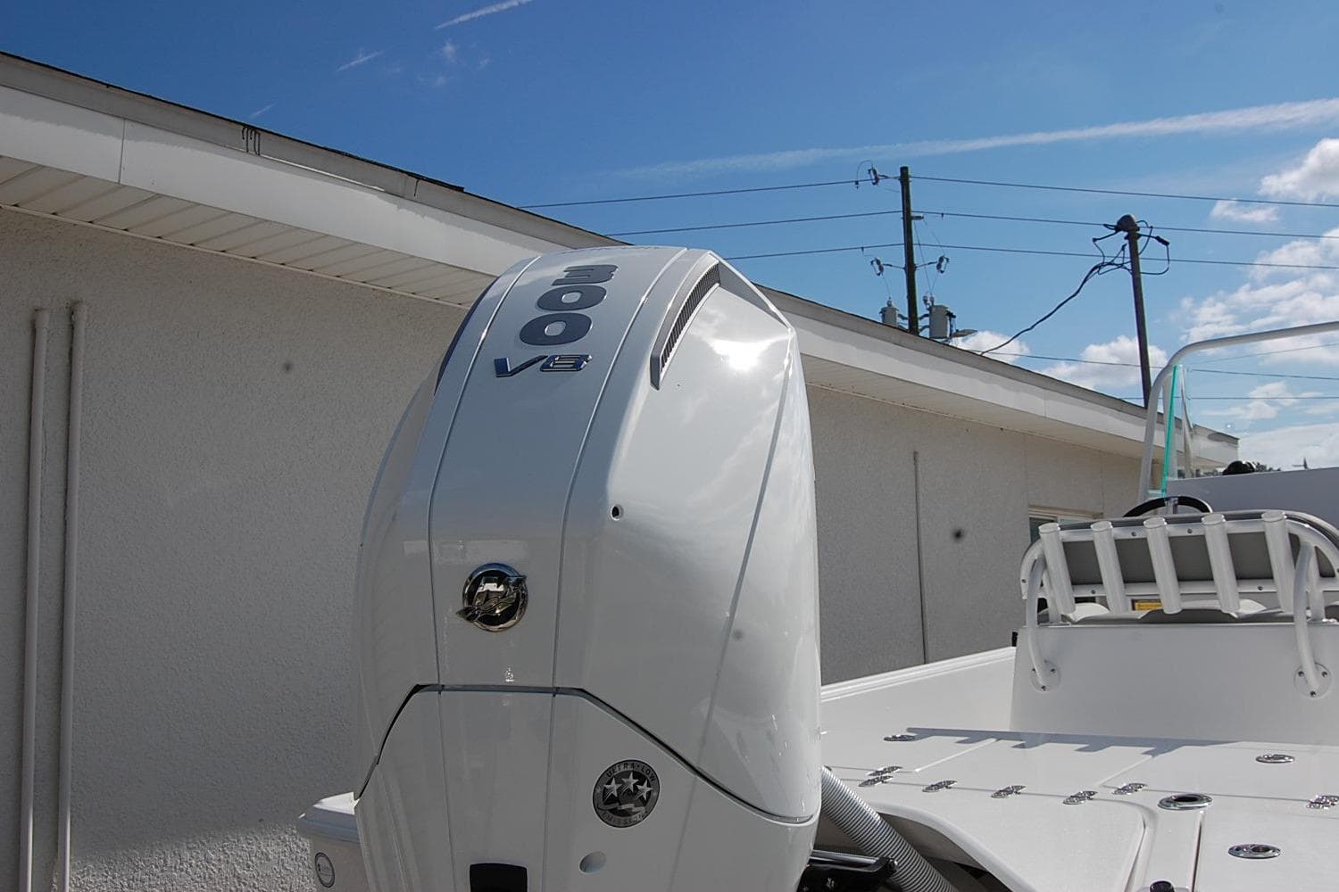 2026 Cape Horn 23 Cape Bay boat with powerful 300 V8 engine, outdoor setting.