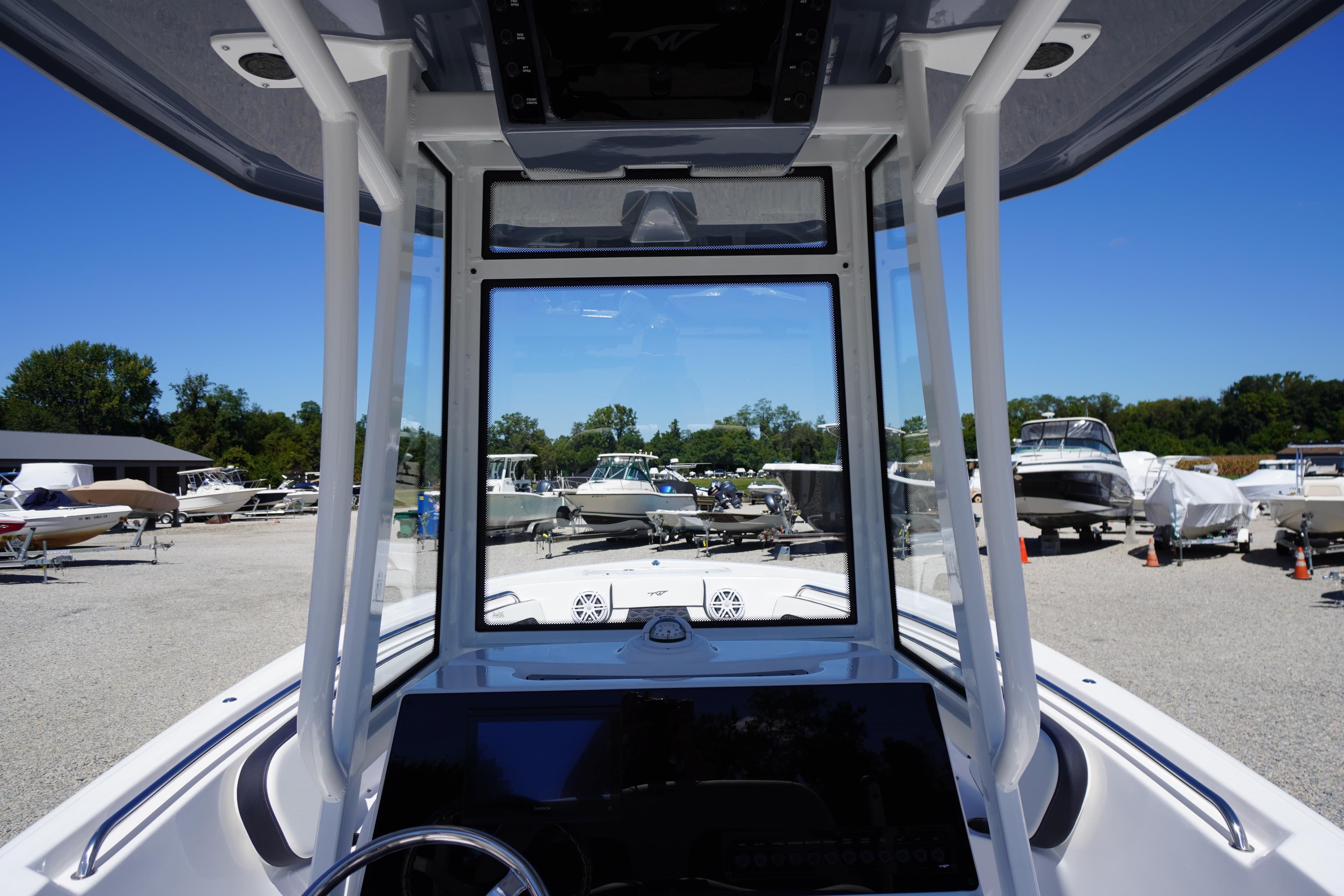 2026 Tidewater 220 CC Adventure boat interior view at a marina.