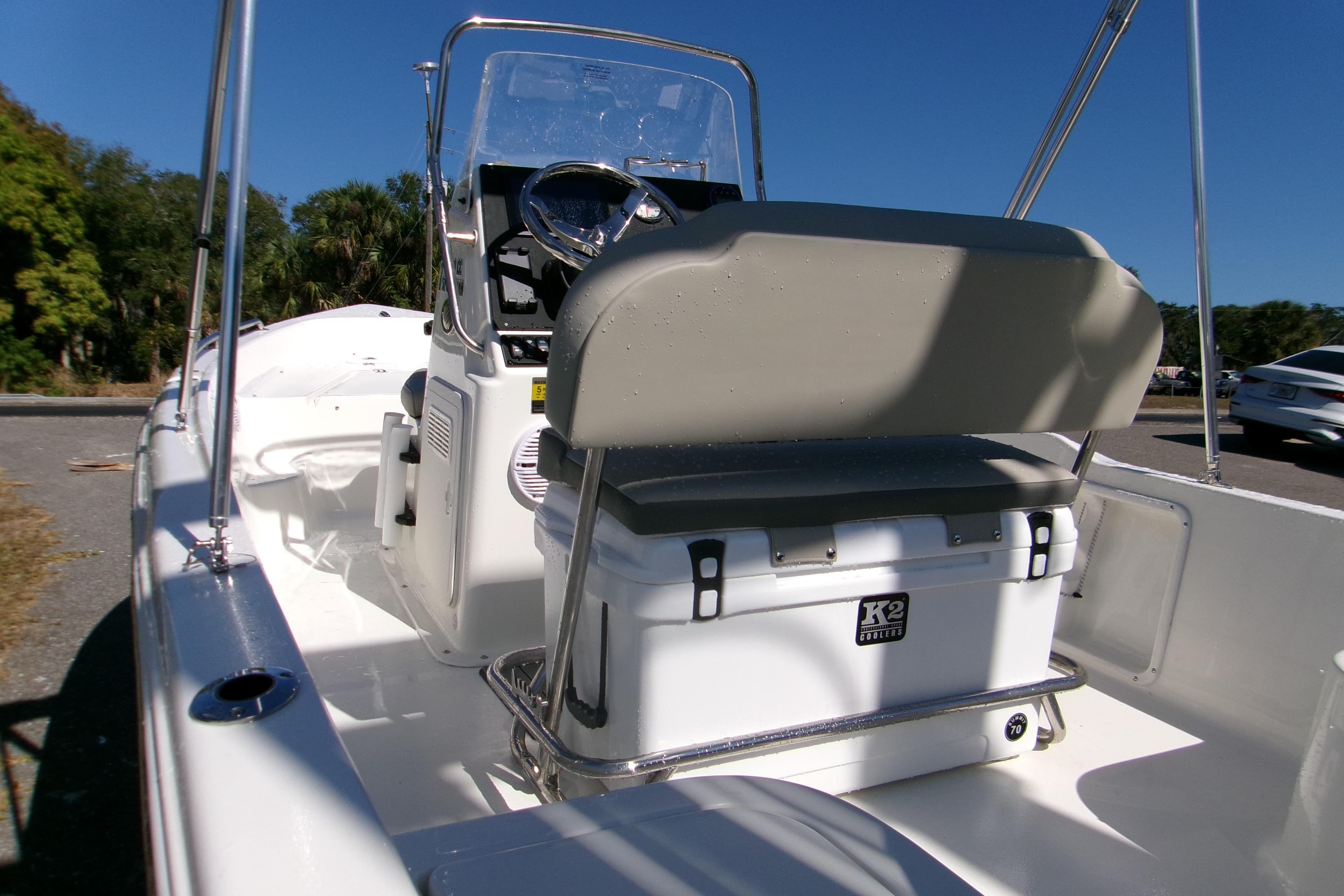 2026 Key West 1720 Center Console boat interior with steering wheel and cooler seat.