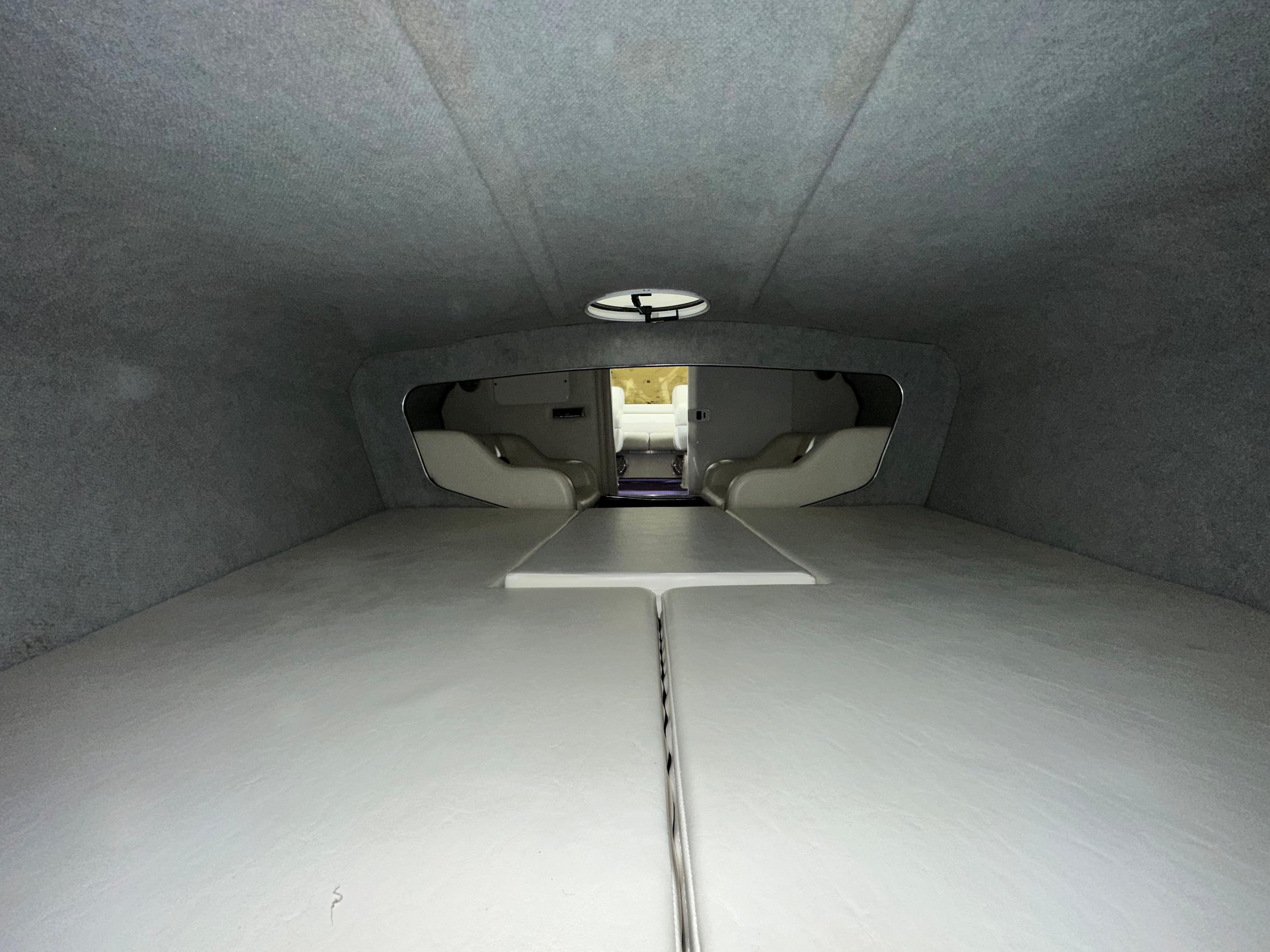 Interior cabin of 2005 Eliminator 260 Eagle XP boat, featuring spacious seating and modern design.