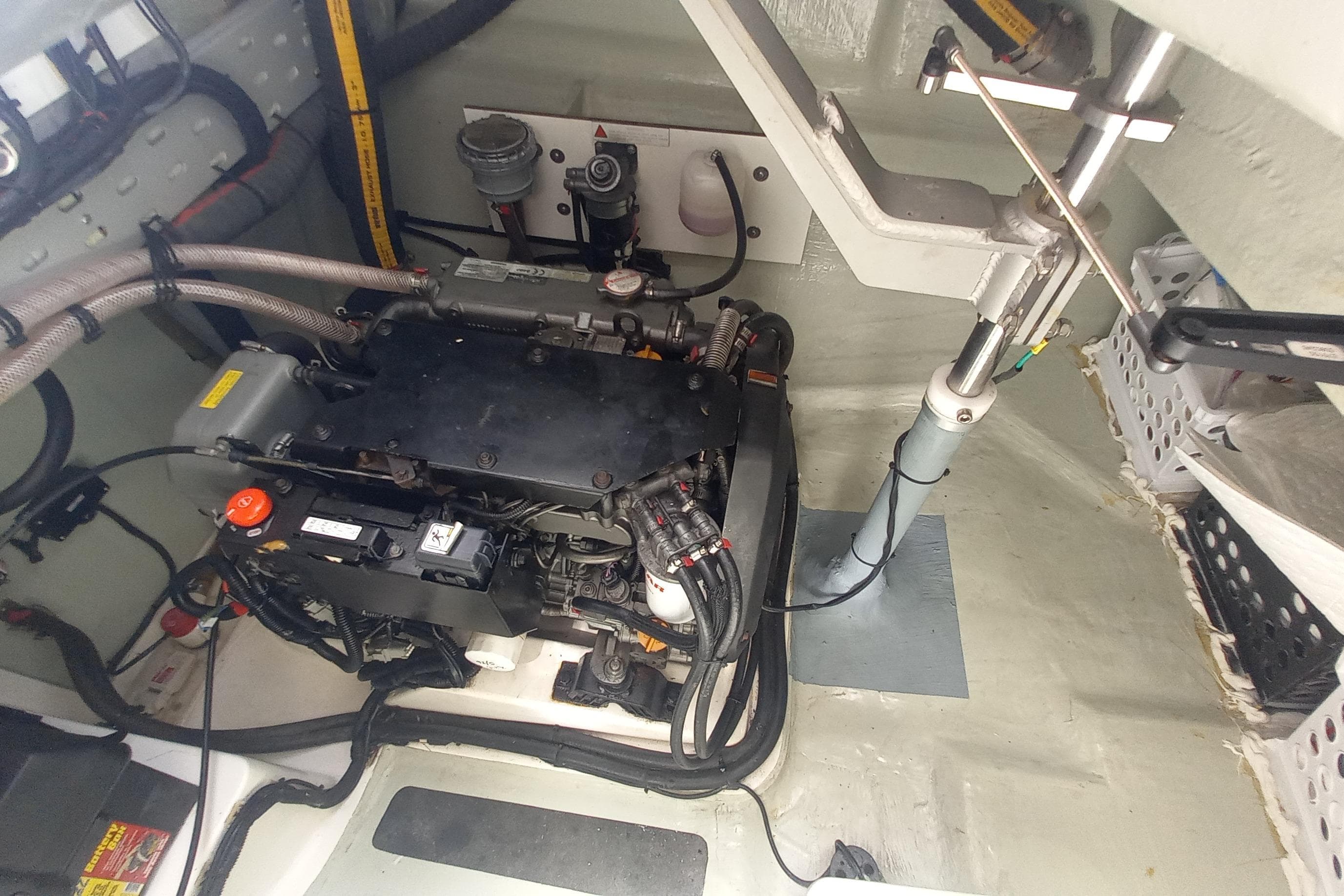 Engine room of a 2019 Leopard 45 catamaran, showcasing mechanical components and wiring.