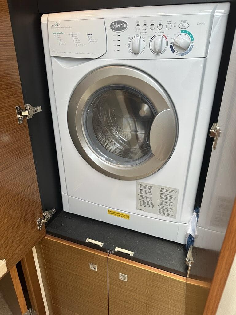 Splendide washer in 2015 Cruisers Yachts 45 Cantius, installed in wooden cabinet.