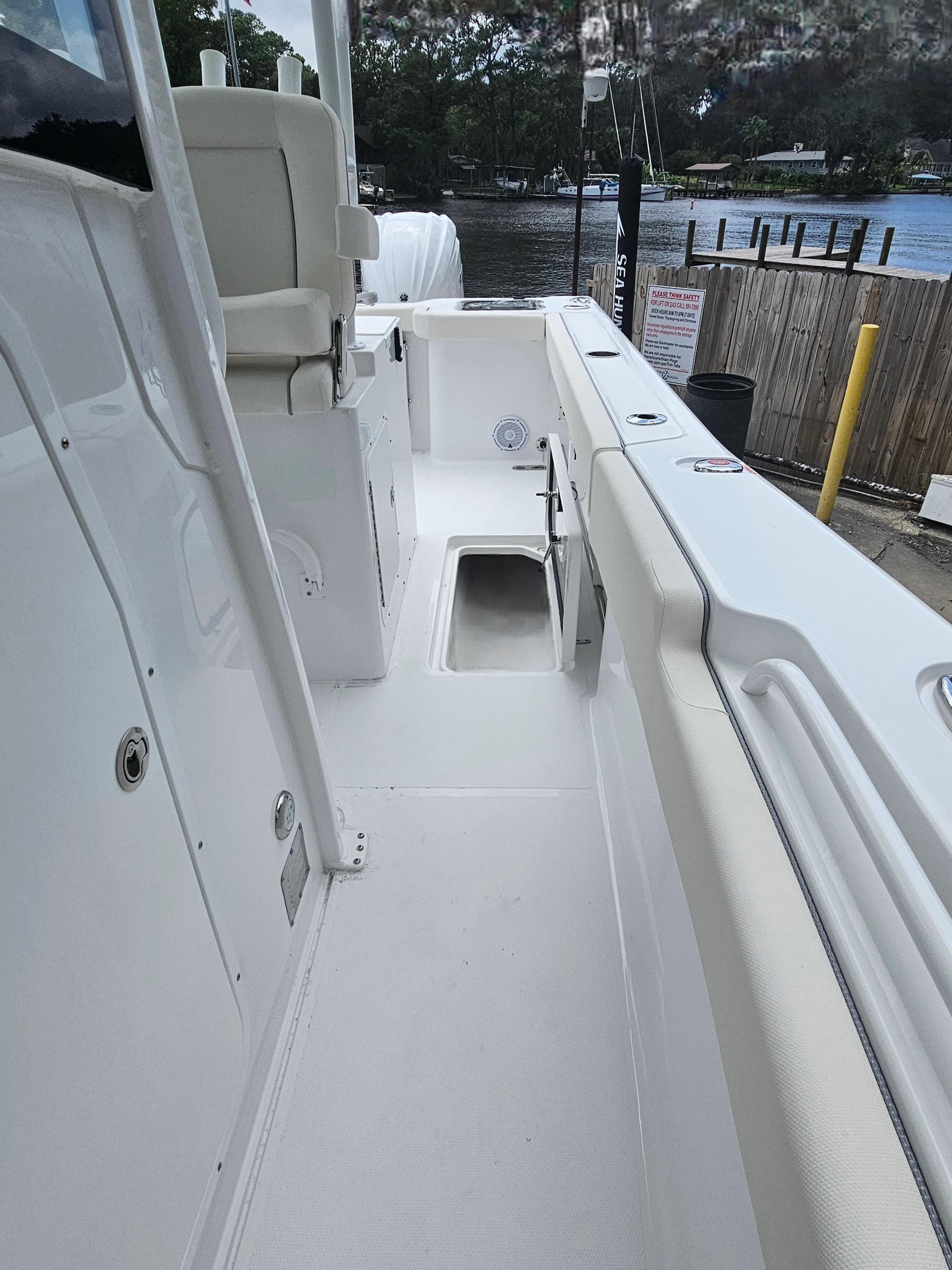 2025 Sea Hunt Gamefish 28 CB boat interior with white seating and deck.