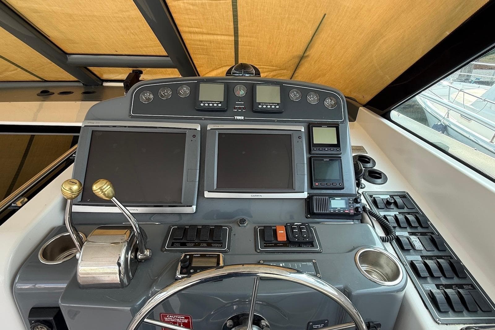 Helm of 2004 Tiara Yachts 3600 Sovran with navigation and control systems.