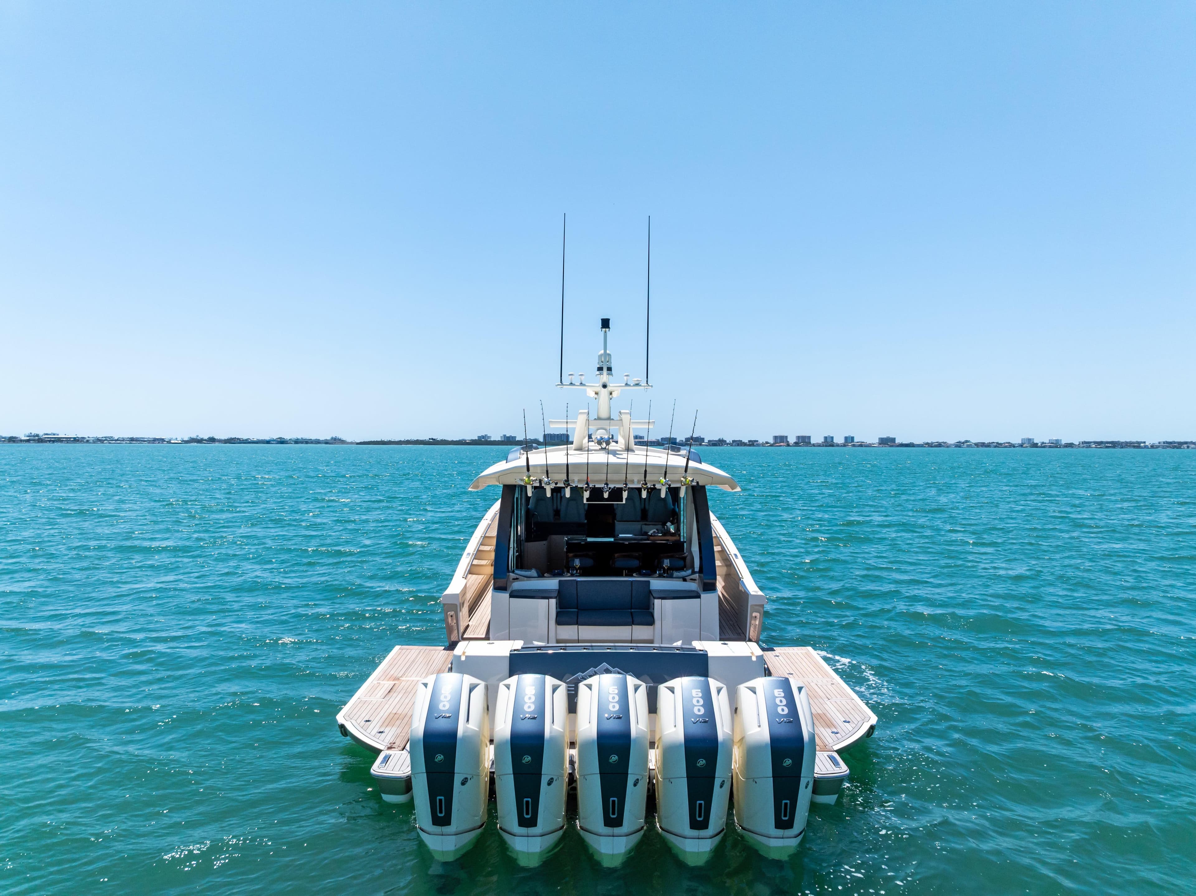 2026 Scout 670 LXS boat with five engines on open water.