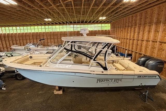 2022 Grady-White Freedom 285 boat in storage, featuring sleek design and spacious interior.