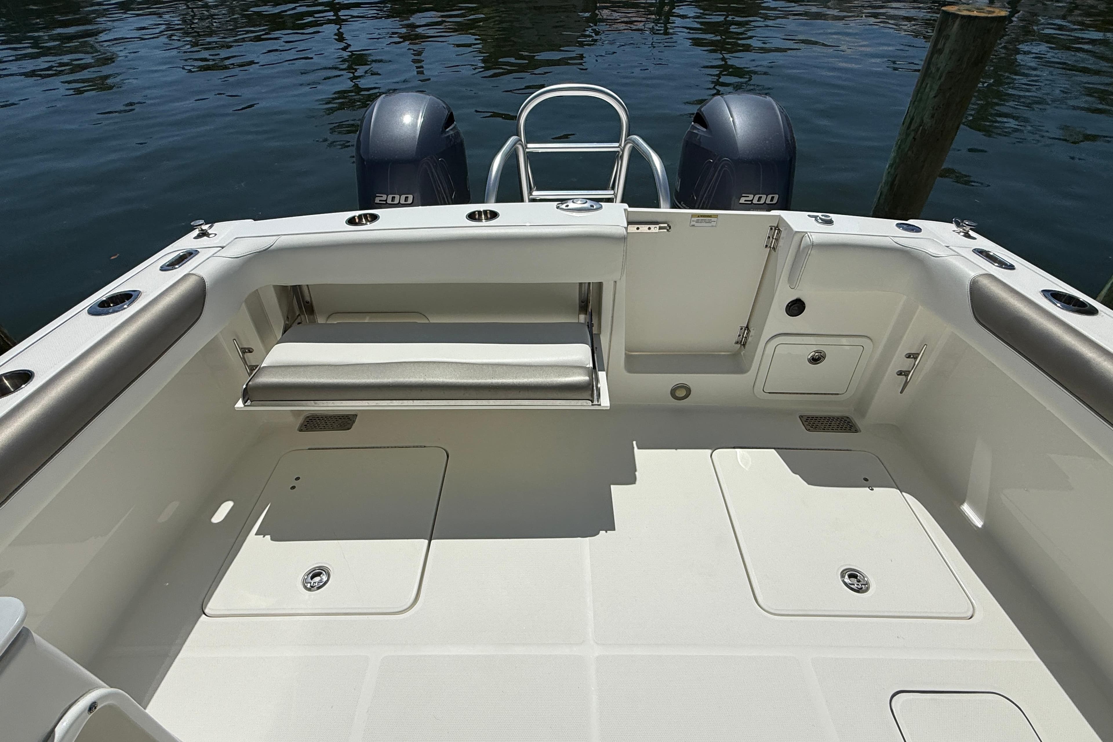 2021 World Cat 280 DC-X boat deck with dual engines and seating area.