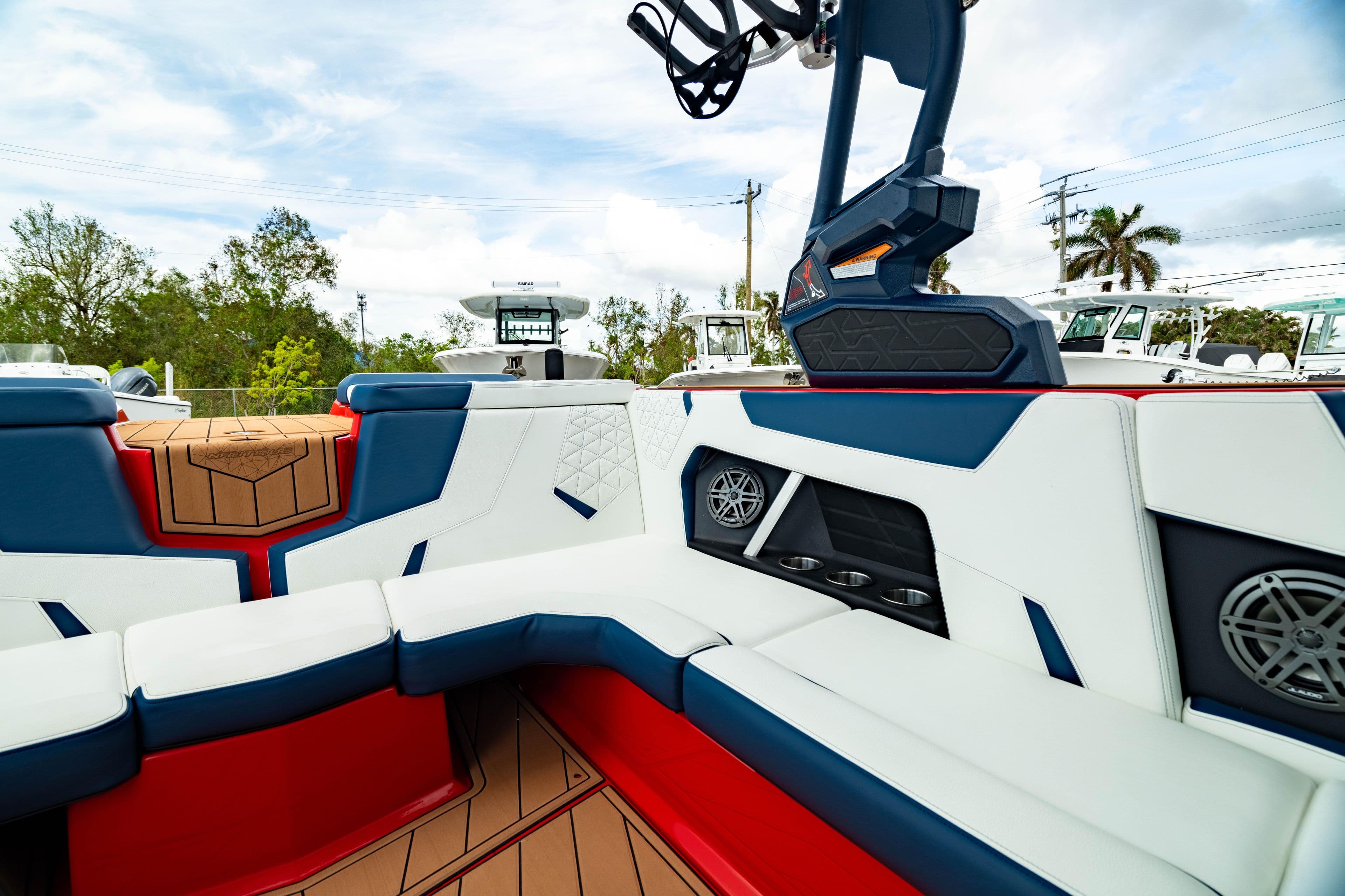 2025 Nautique Super Air Nautique GS20 interior with red, white, and blue seating.