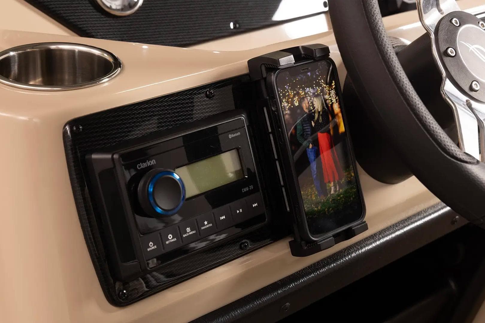 2024 SunCatcher Select 322RC dashboard with Bluetooth stereo and smartphone holder.