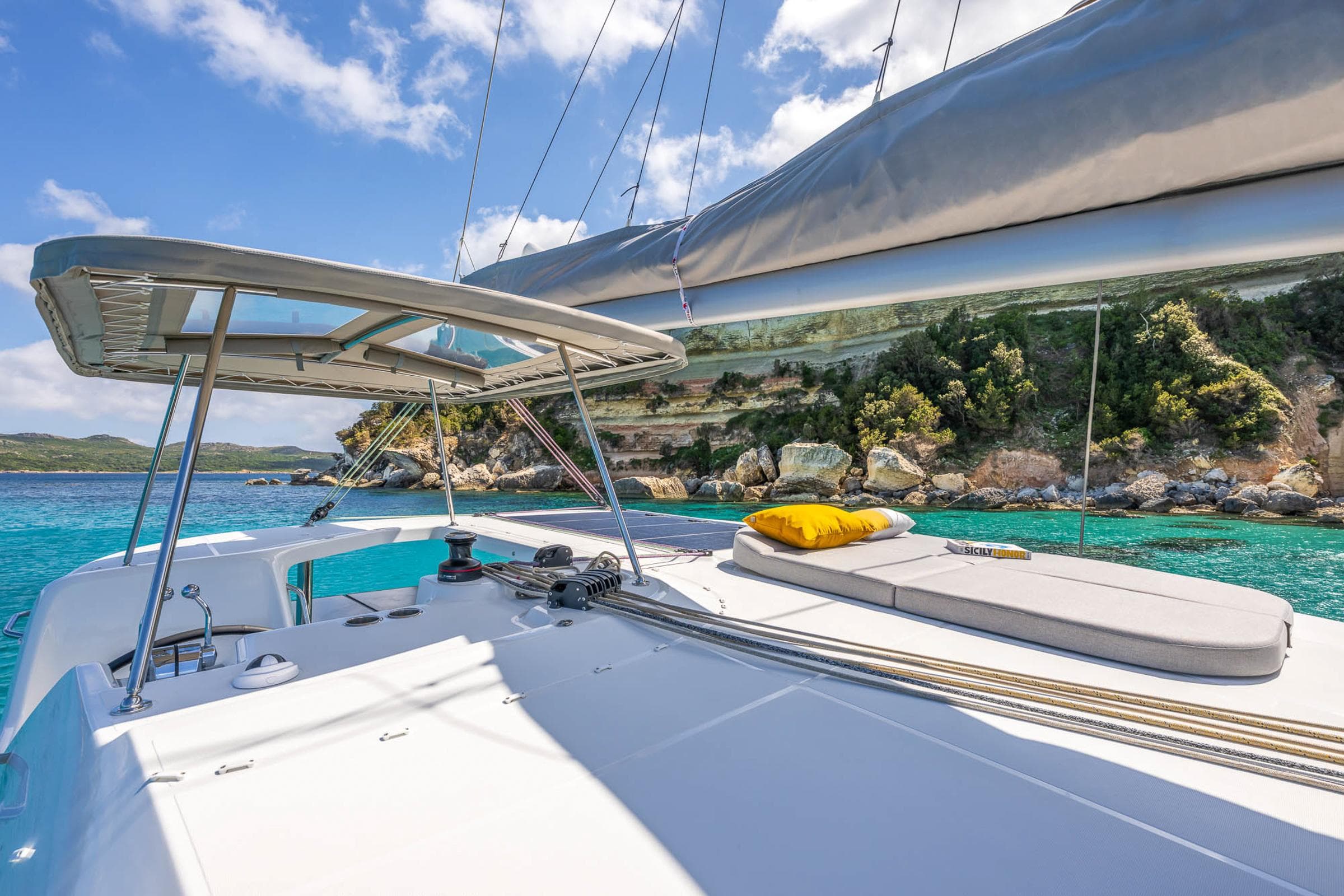 Modern Lagoon 38 catamaran sailing in clear turquoise waters, 2025 model.