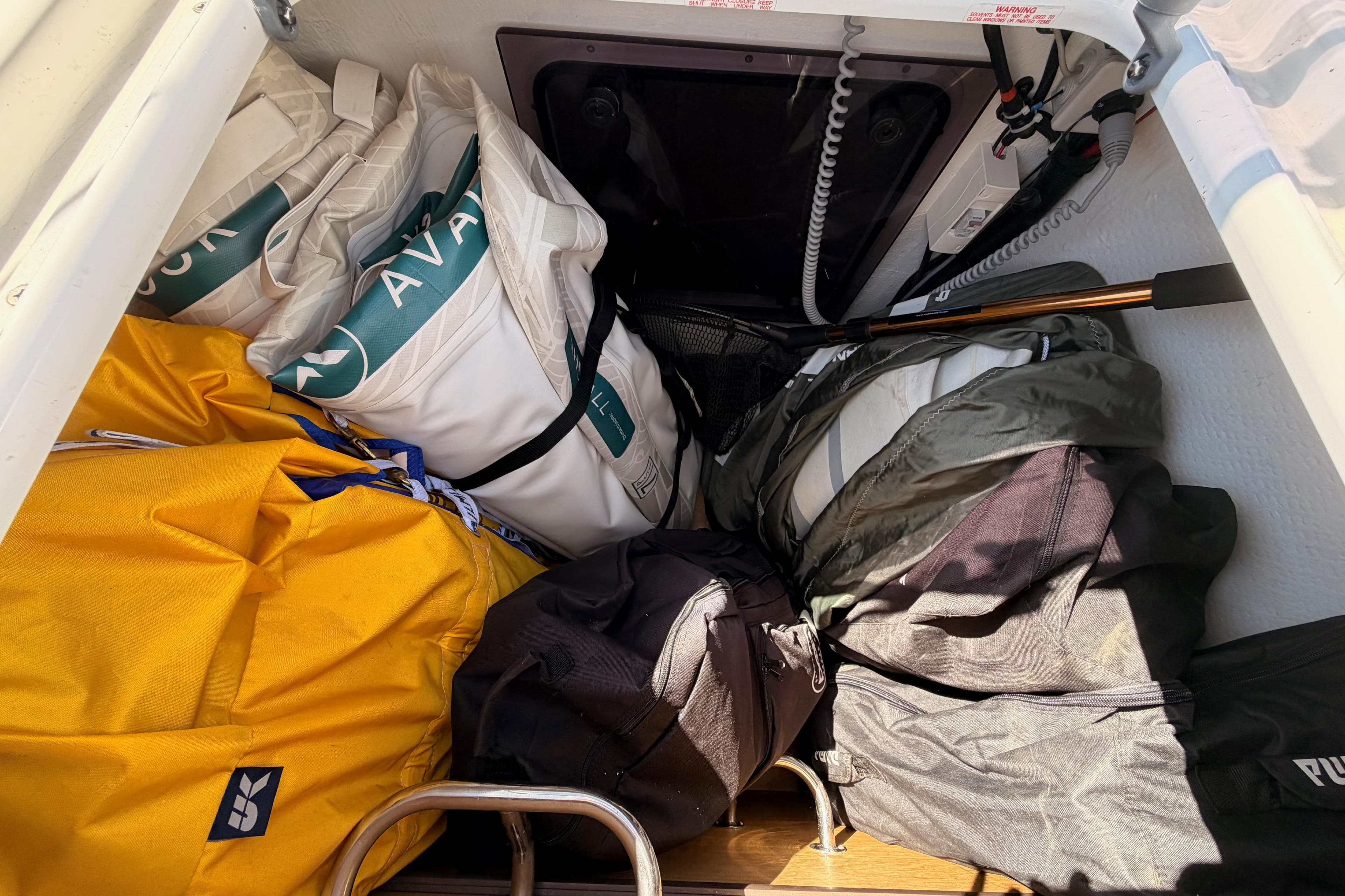 Storage compartment of 2019 Dufour 460 Grand Large with sails and gear.