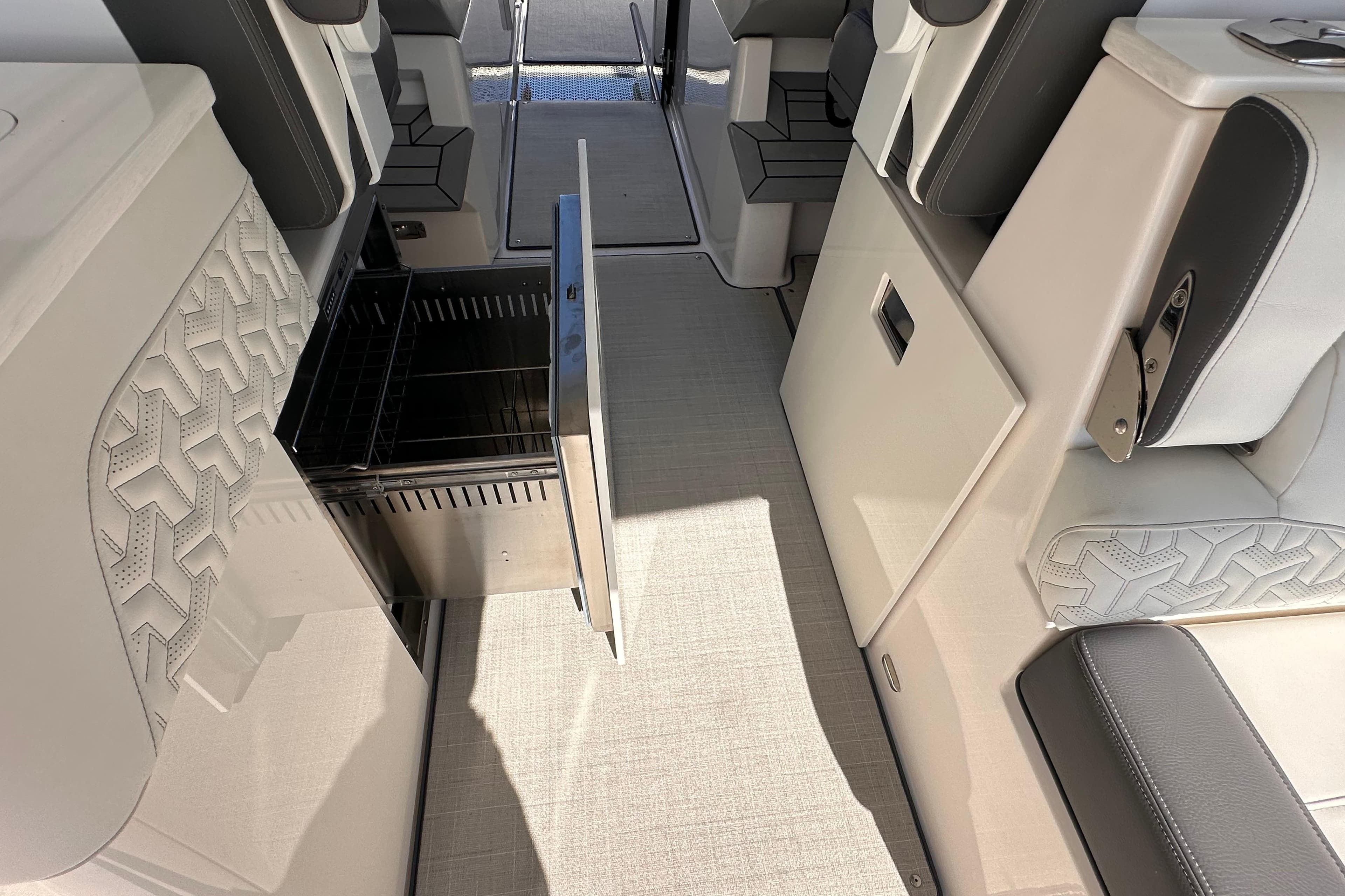 2025 Regal LX36 interior with open storage compartment and modern seating design.